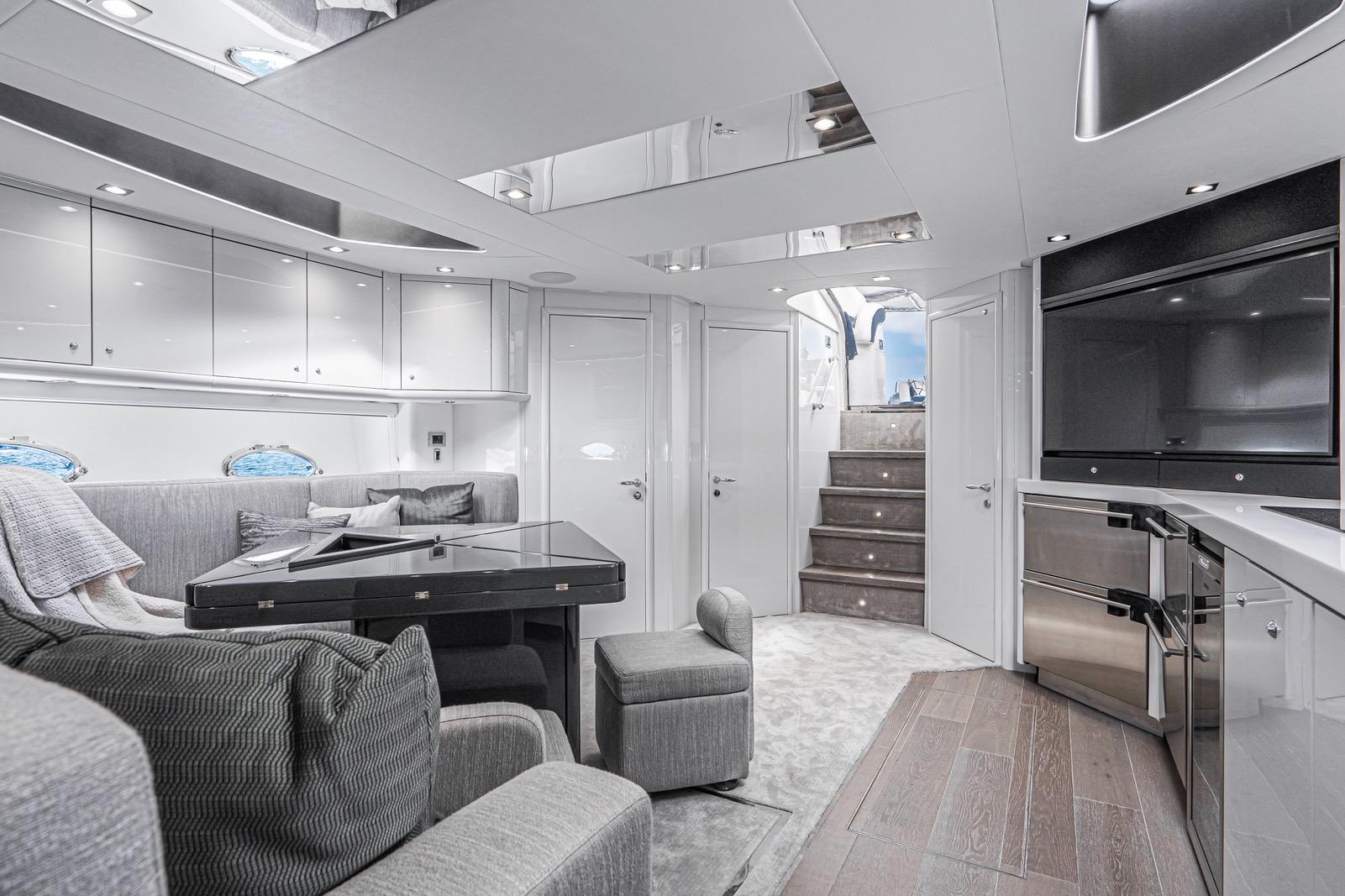 Luxurious interior of 2021 Sunseeker Predator 68 yacht with modern furnishings and sleek design.