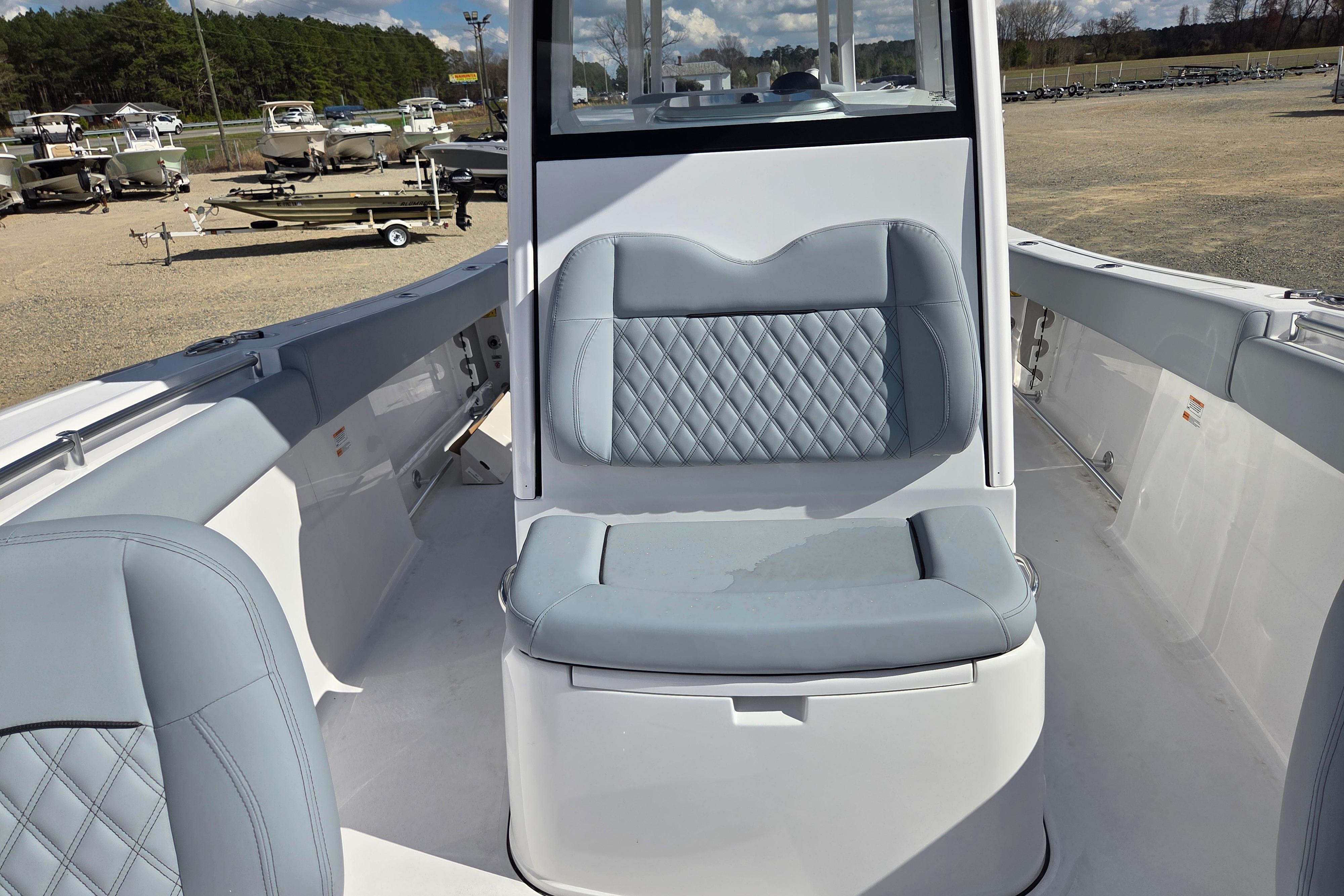 2026 Sportsman Open 282 Center Console boat interior with cushioned seating.