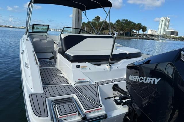 2022 Sea Ray SPX 210 Outboard boat with Mercury engine, docked on a sunny day.