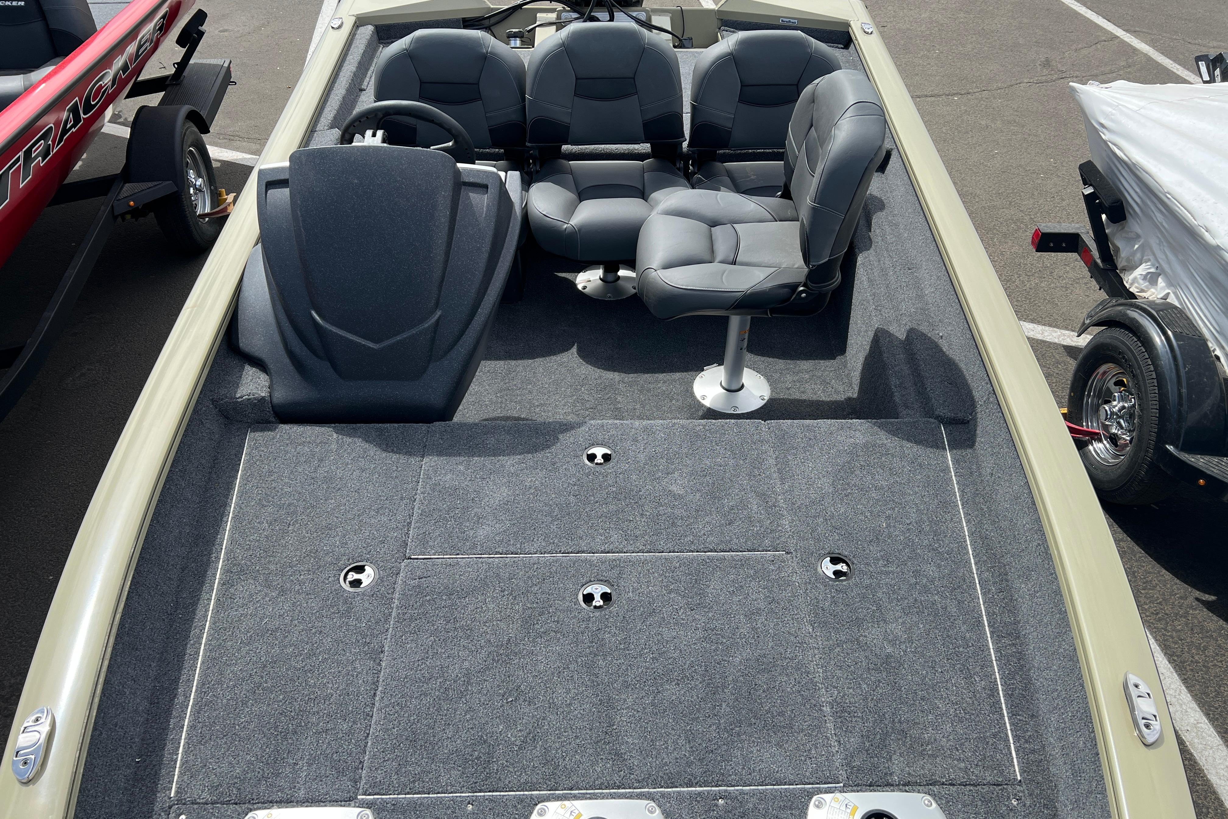 2026 Tracker Pro Team 175 Crappie Edition boat interior with seating and carpeted deck.