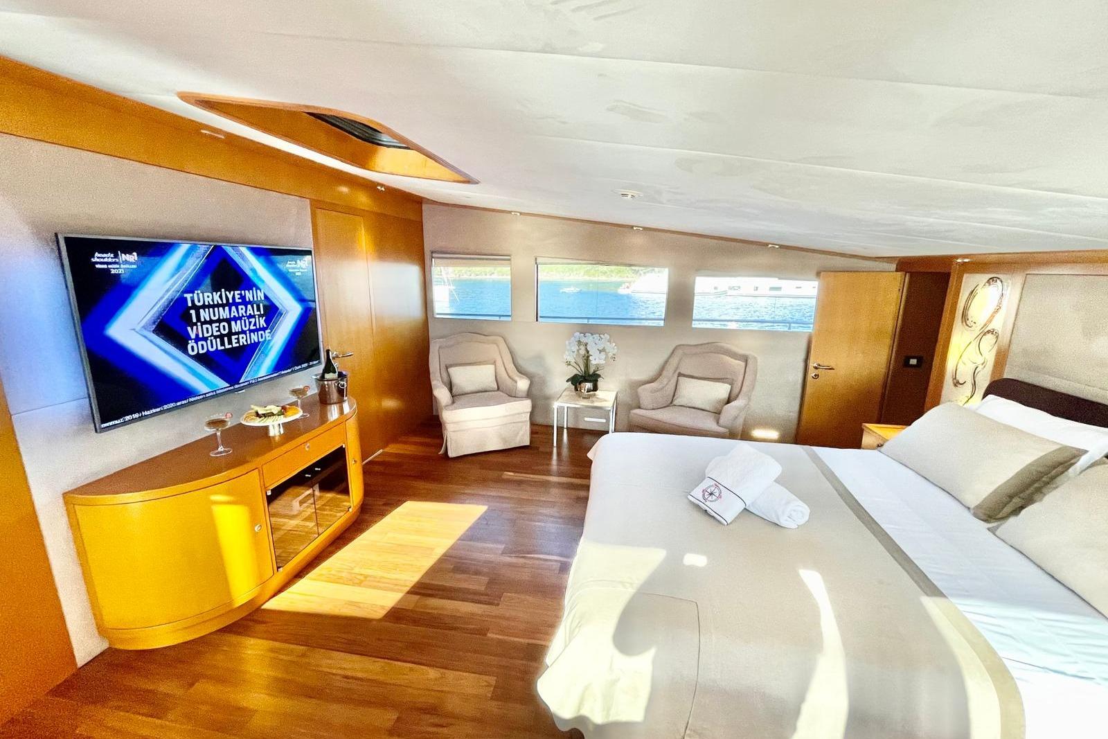 Luxurious bedroom interior of 2008 Baglietto 34m Fast Yacht, featuring elegant decor and modern amenities.