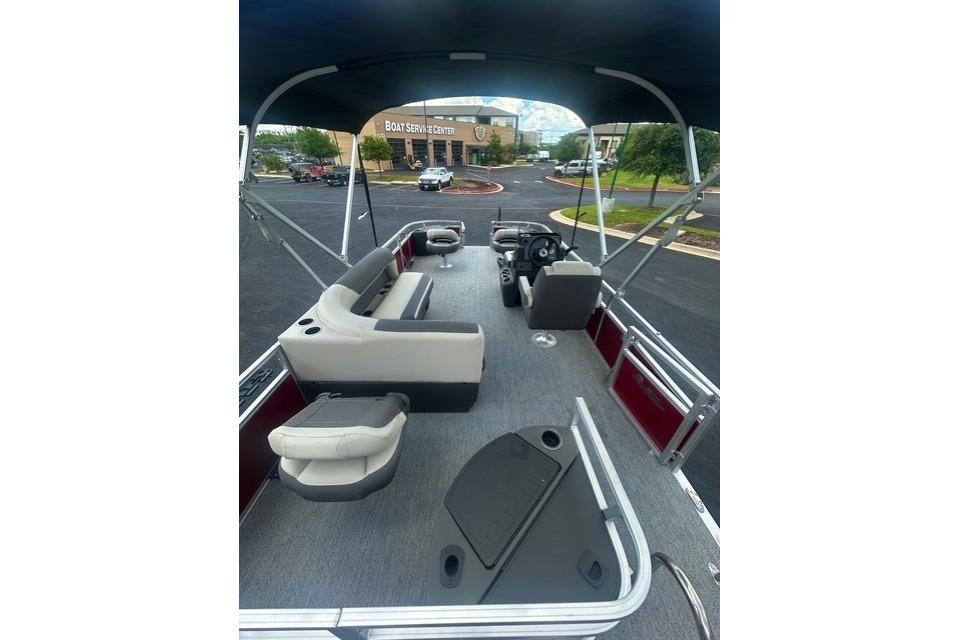 2026 Sun Tracker Bass Buggy 18 DLX pontoon boat interior with seating and helm.