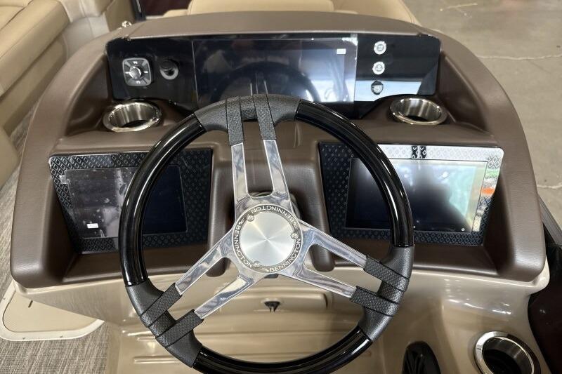 Steering console of 2026 Bennington 24 LXS Quadbench with modern controls and displays.
