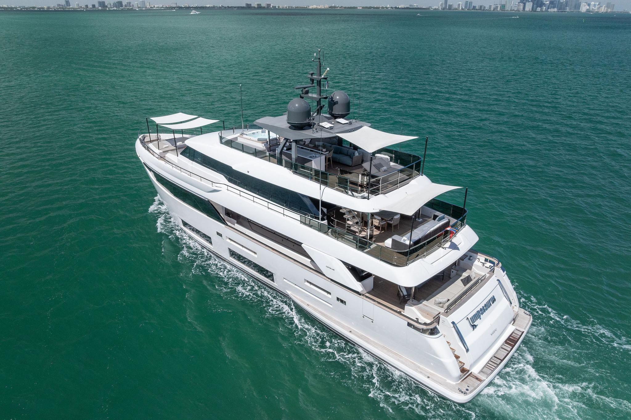 Luxurious 2023 Custom Line Navetta 33 yacht cruising on turquoise waters.