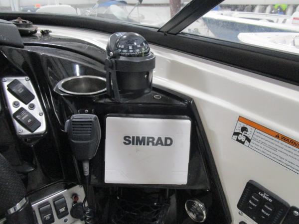 Control panel of 2017 Larson 292 LXI boat with Simrad navigation system.