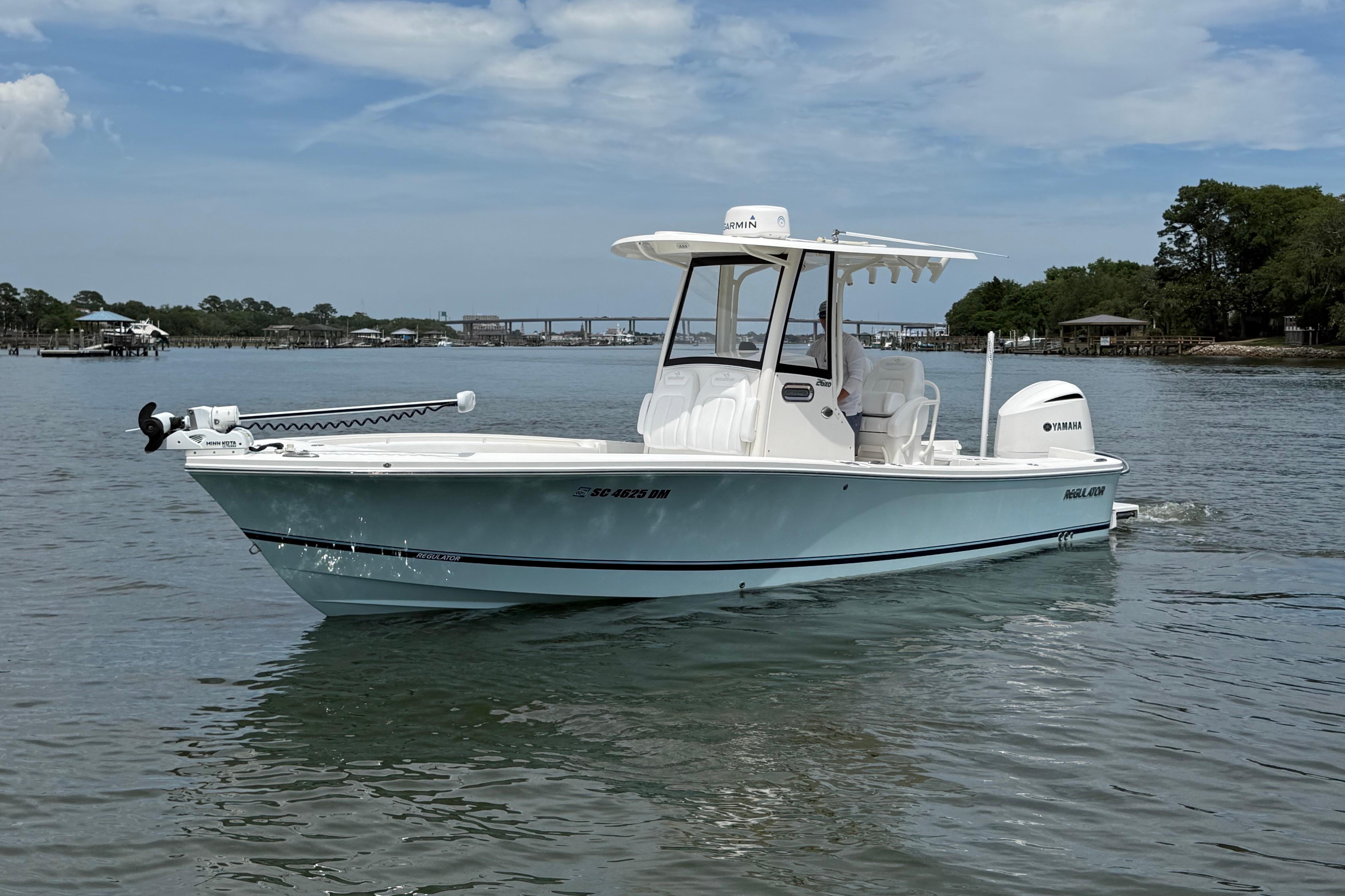 2019 Regulator 26XO boat on calm water, featuring Yamaha engine and Garmin equipment.