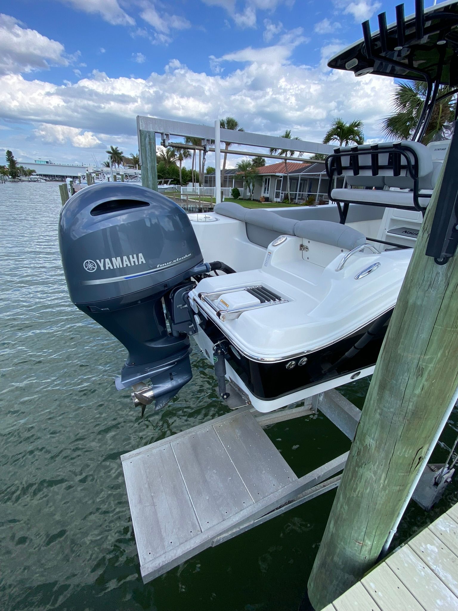 2021 NauticStar Legacy boat with Yamaha outboard motor at dock.
