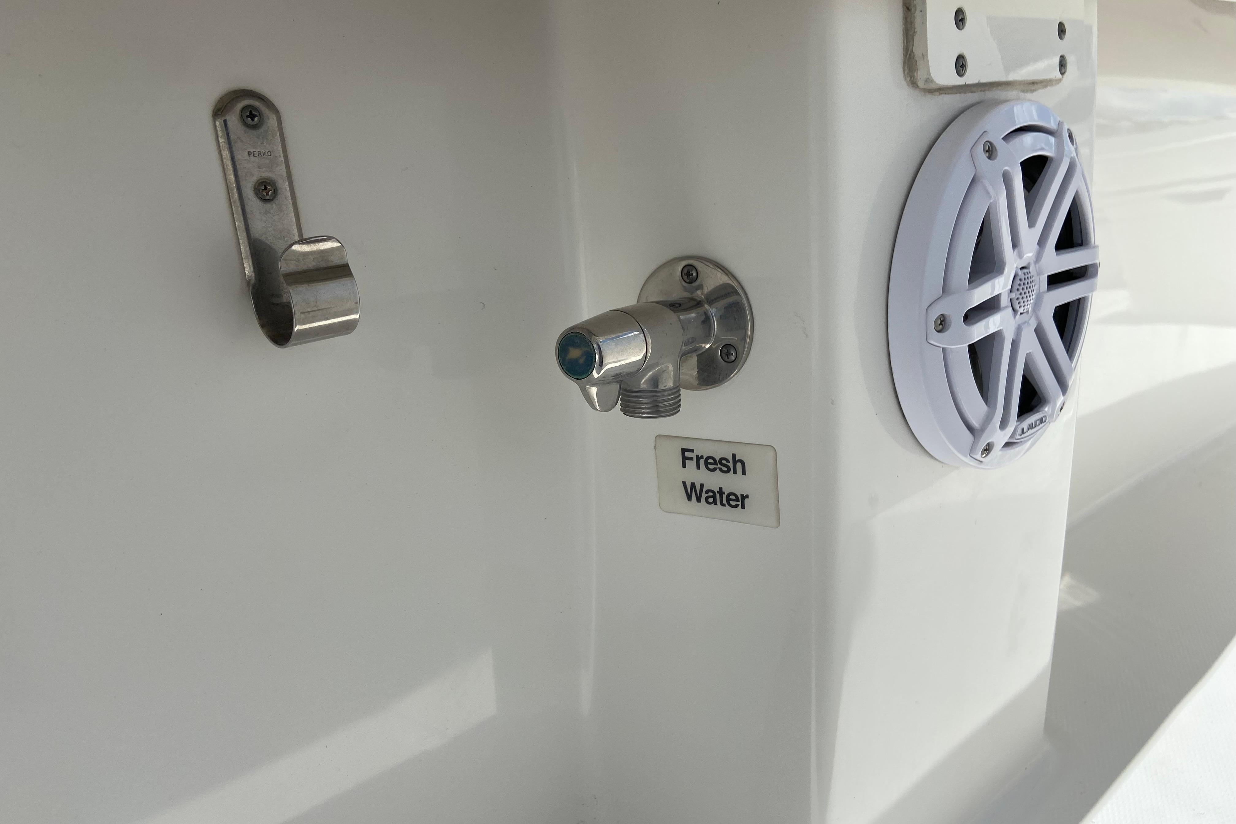 Fresh water outlet and speaker on 2021 Regulator 28 boat.
