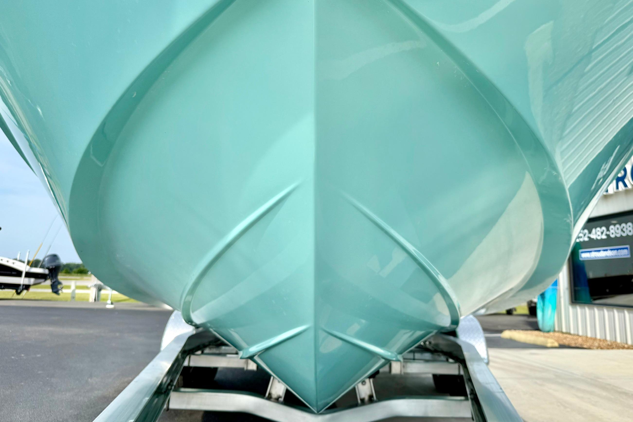 Close-up of 2026 Carolina Skiff 24 Ultra Elite boat hull on trailer.