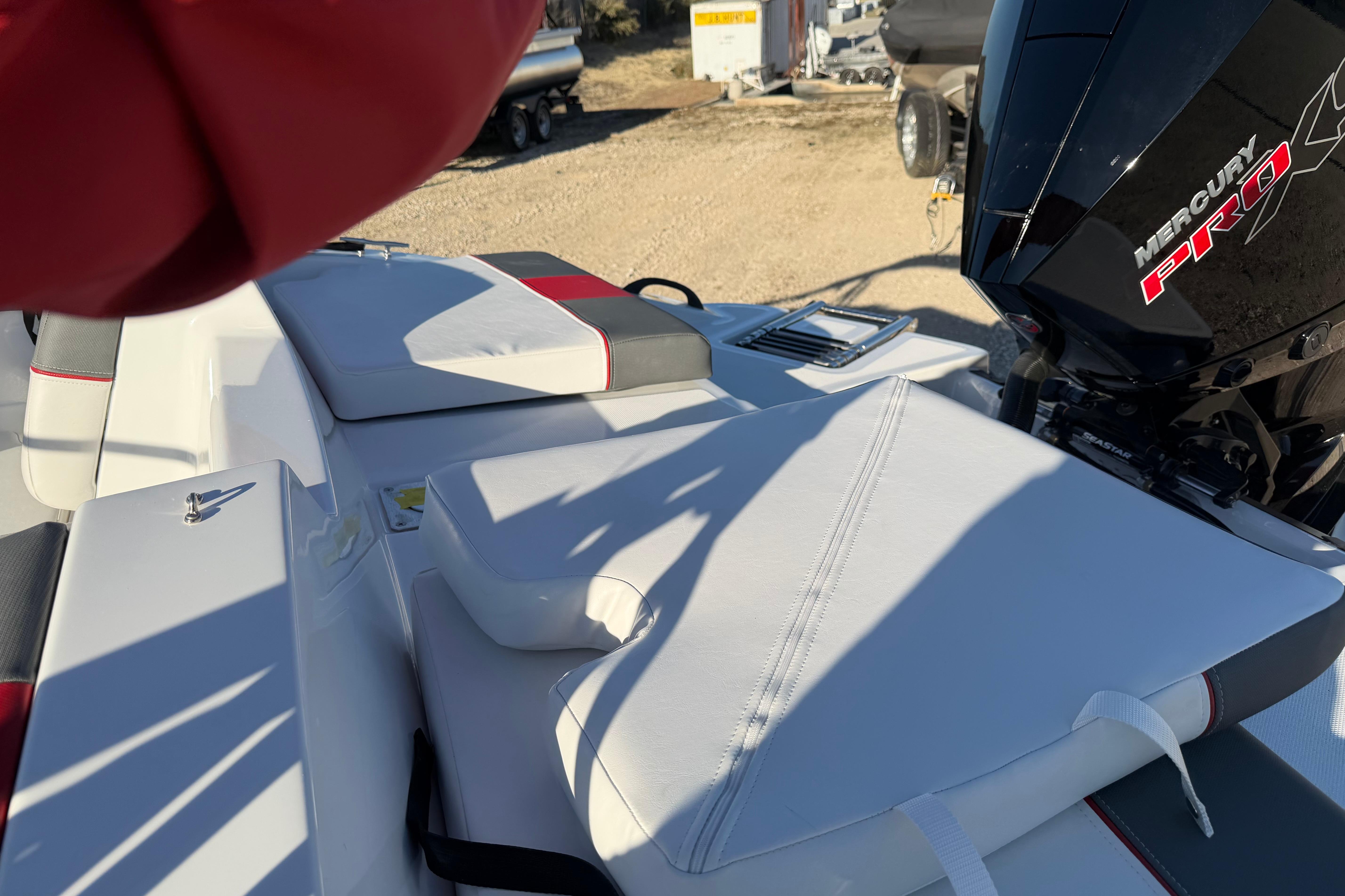 2026 Tahoe T21 boat with Mercury Pro motor, featuring white cushioned seating.