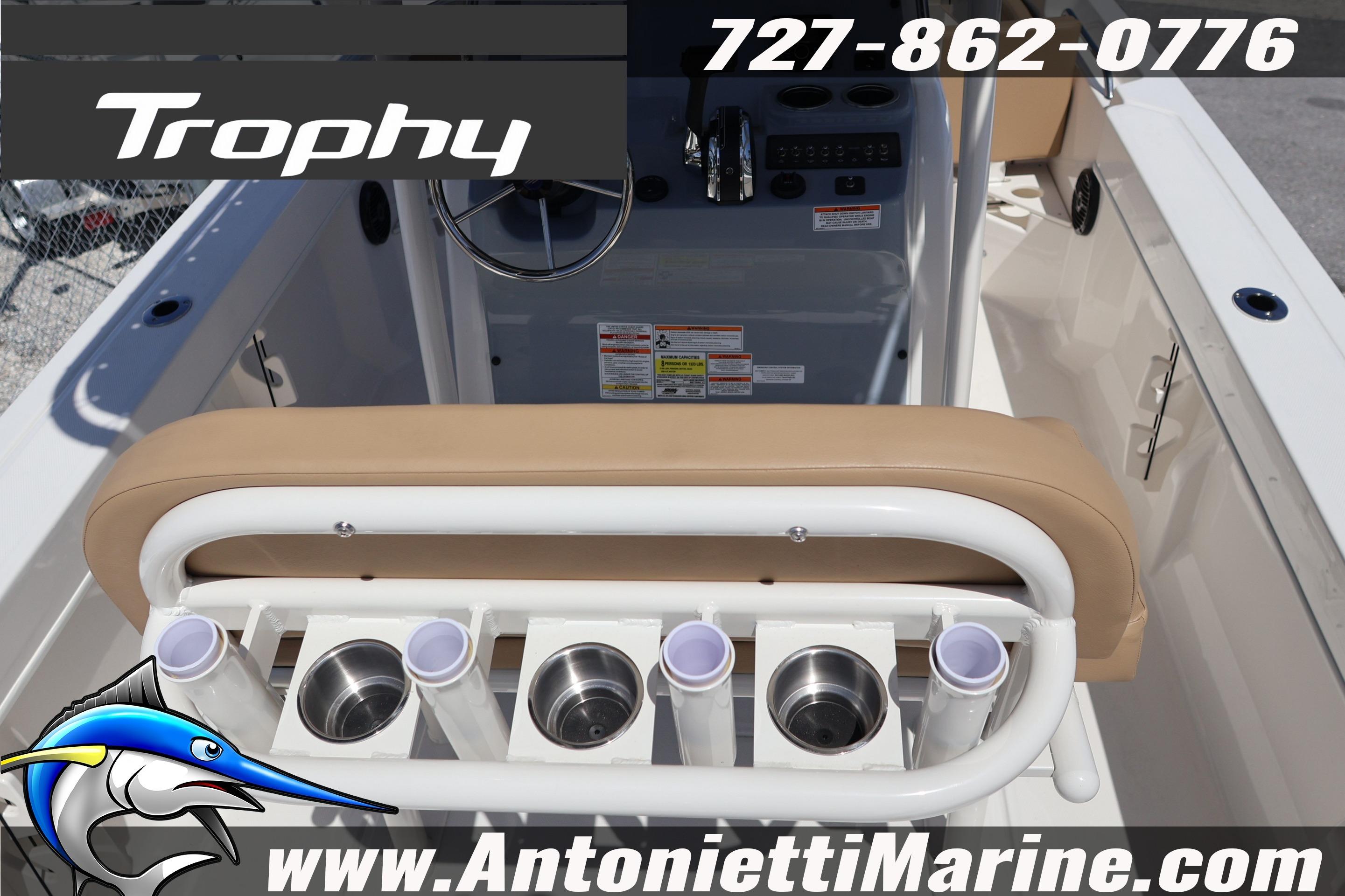 2026 Bayliner Trophy T20CC boat interior with rod holders and steering console.