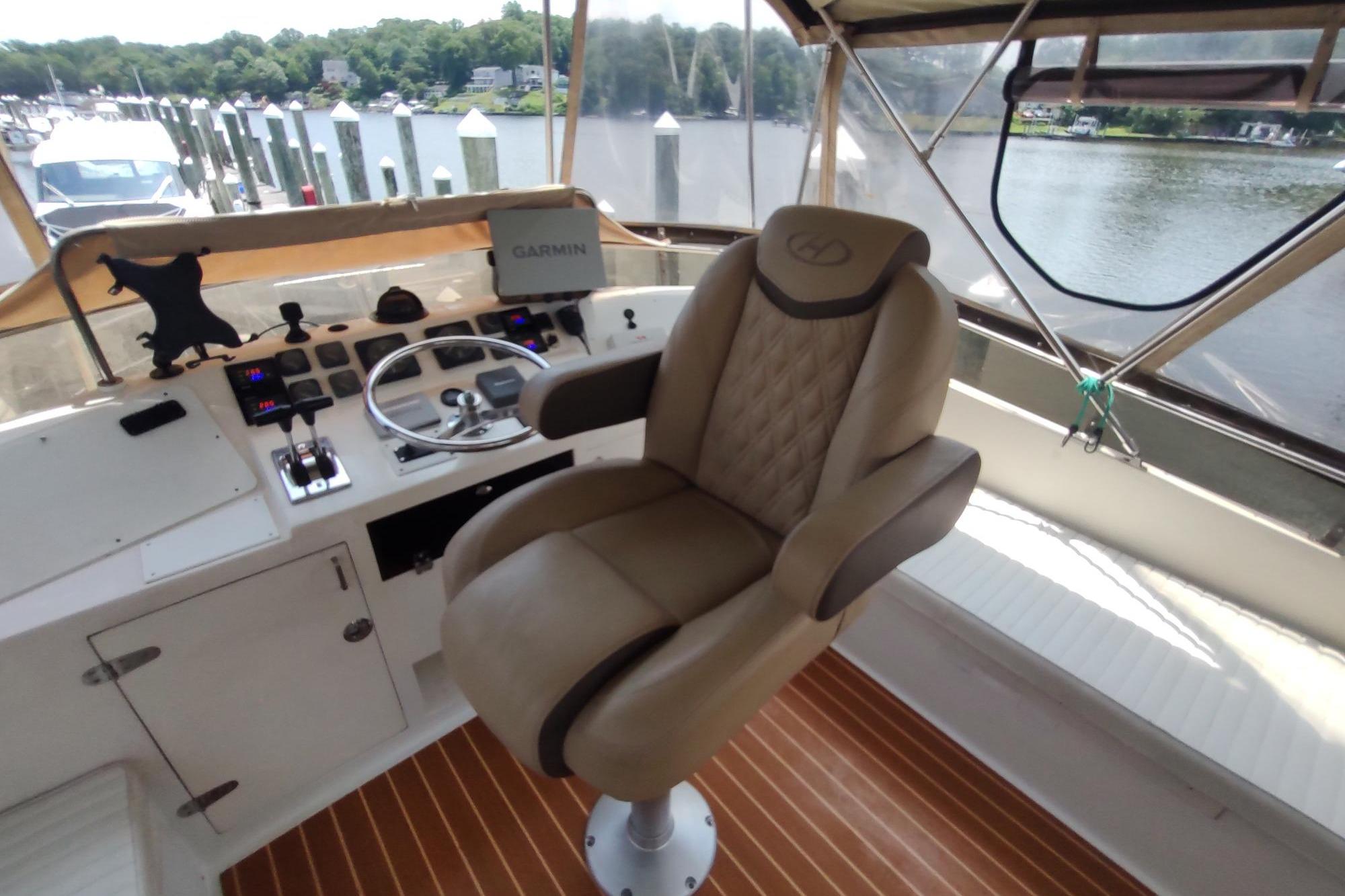 Captain's chair and helm of 1989 Hyatt Double Cabin Motoryacht, featuring Garmin navigation.