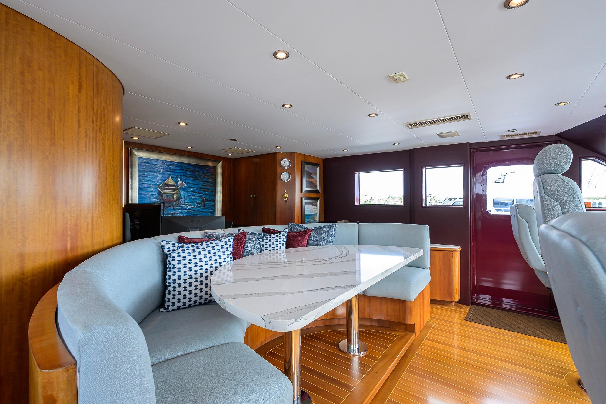 Luxurious 2003 Cheoy Lee Trideck yacht interior with elegant seating and modern decor.