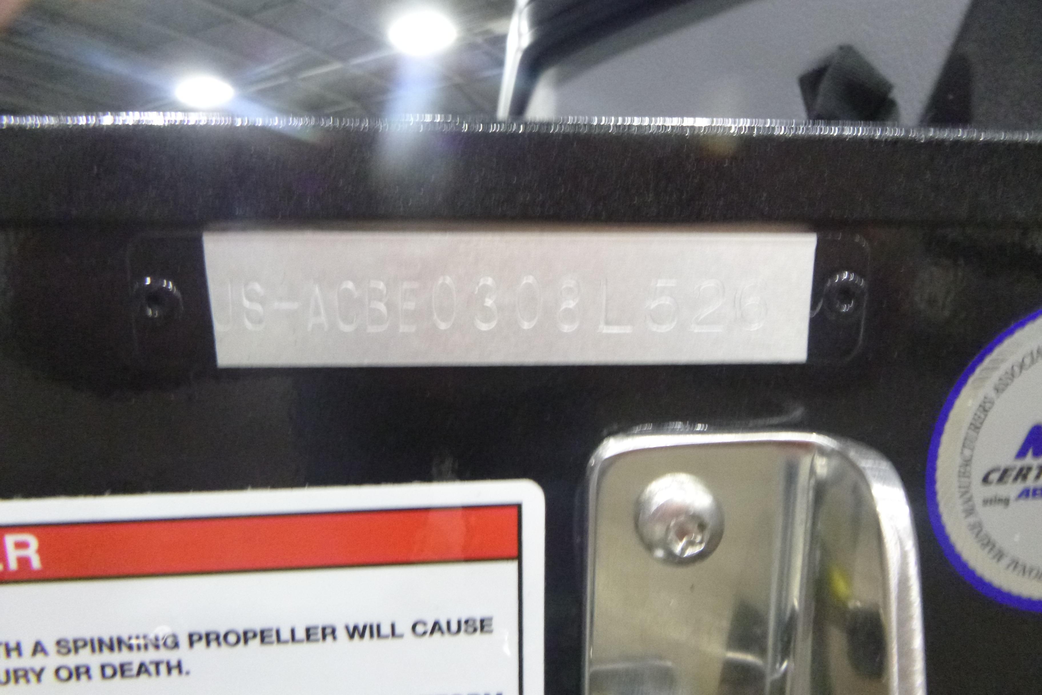 2026 Alumacraft Trophy 205X Sport boat identification plate with warning label.