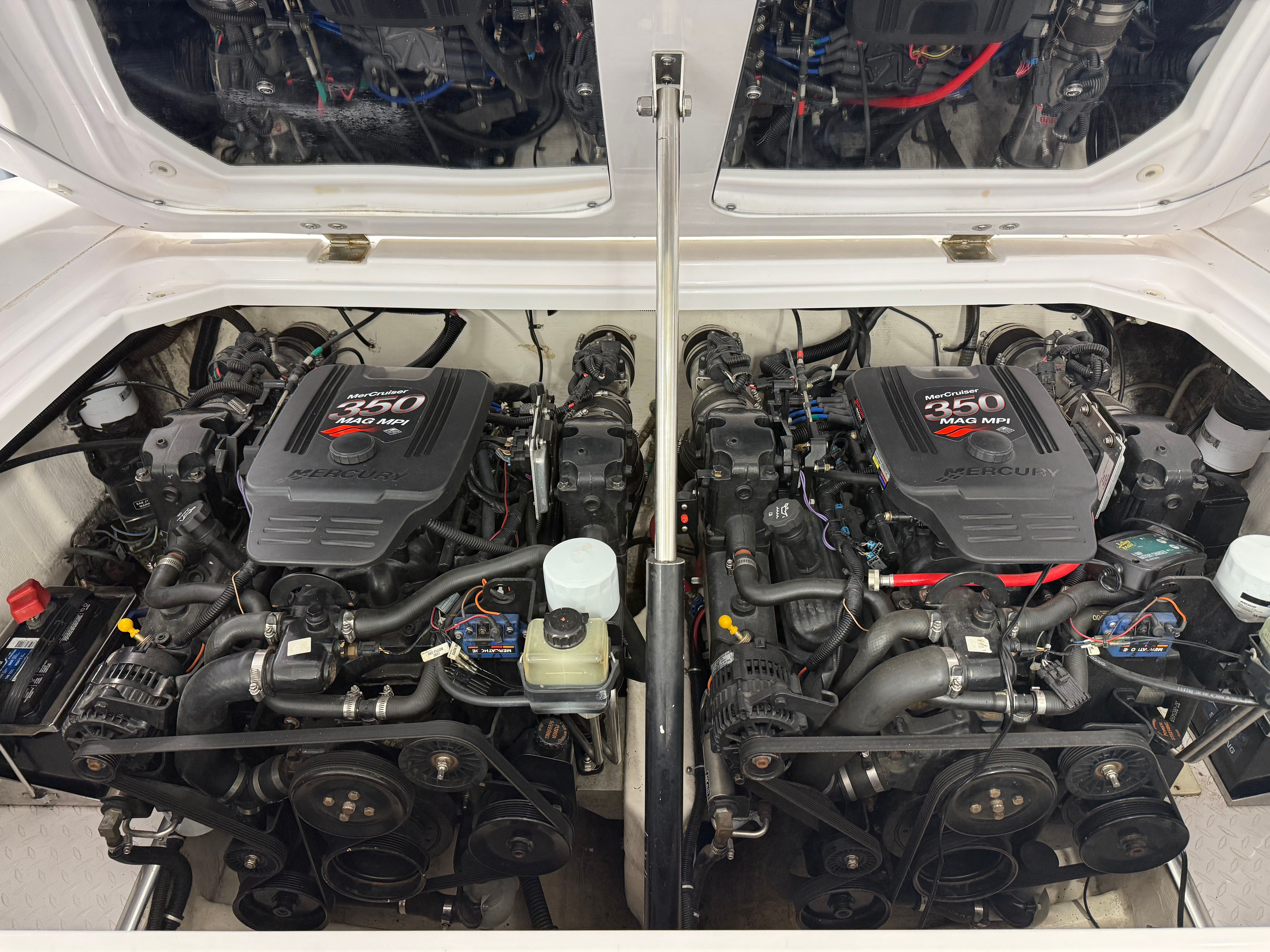 Two powerful engines in the engine compartment of a 2003 Donzi 28 ZX.