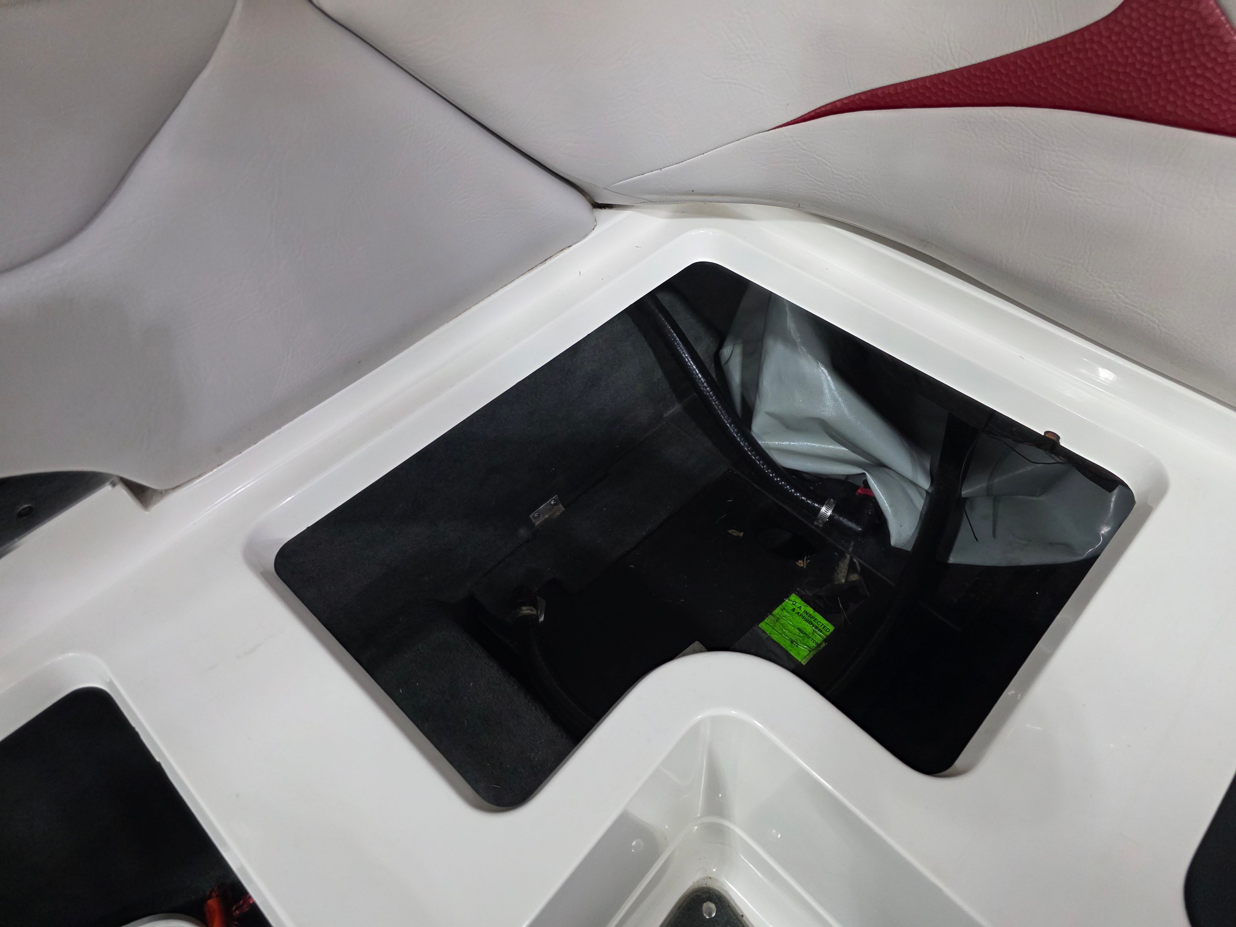Interior of a 2007 MasterCraft X-15 boat with storage compartment.