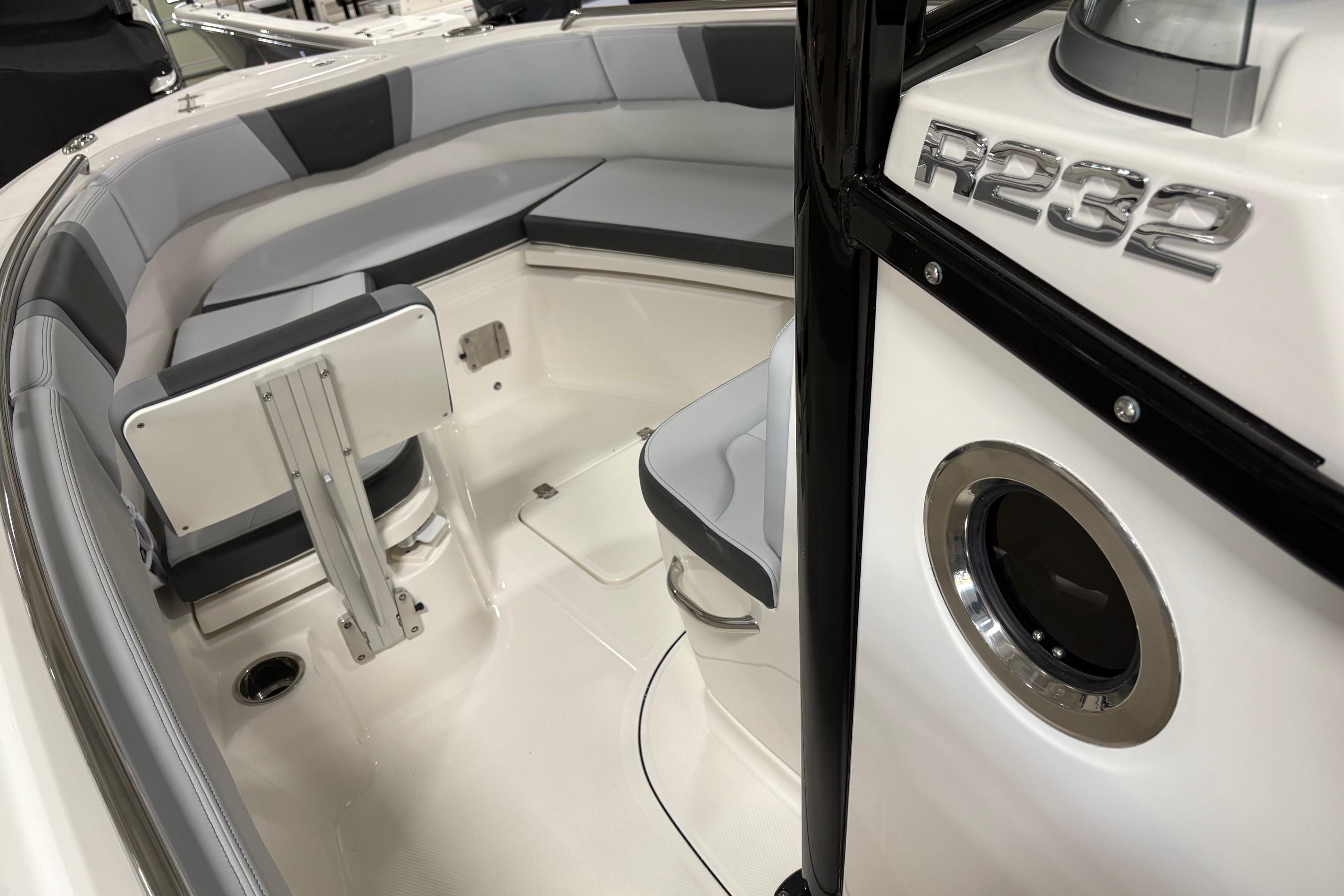 2025 Robalo R232 Explorer boat interior with cushioned seating and sleek design.