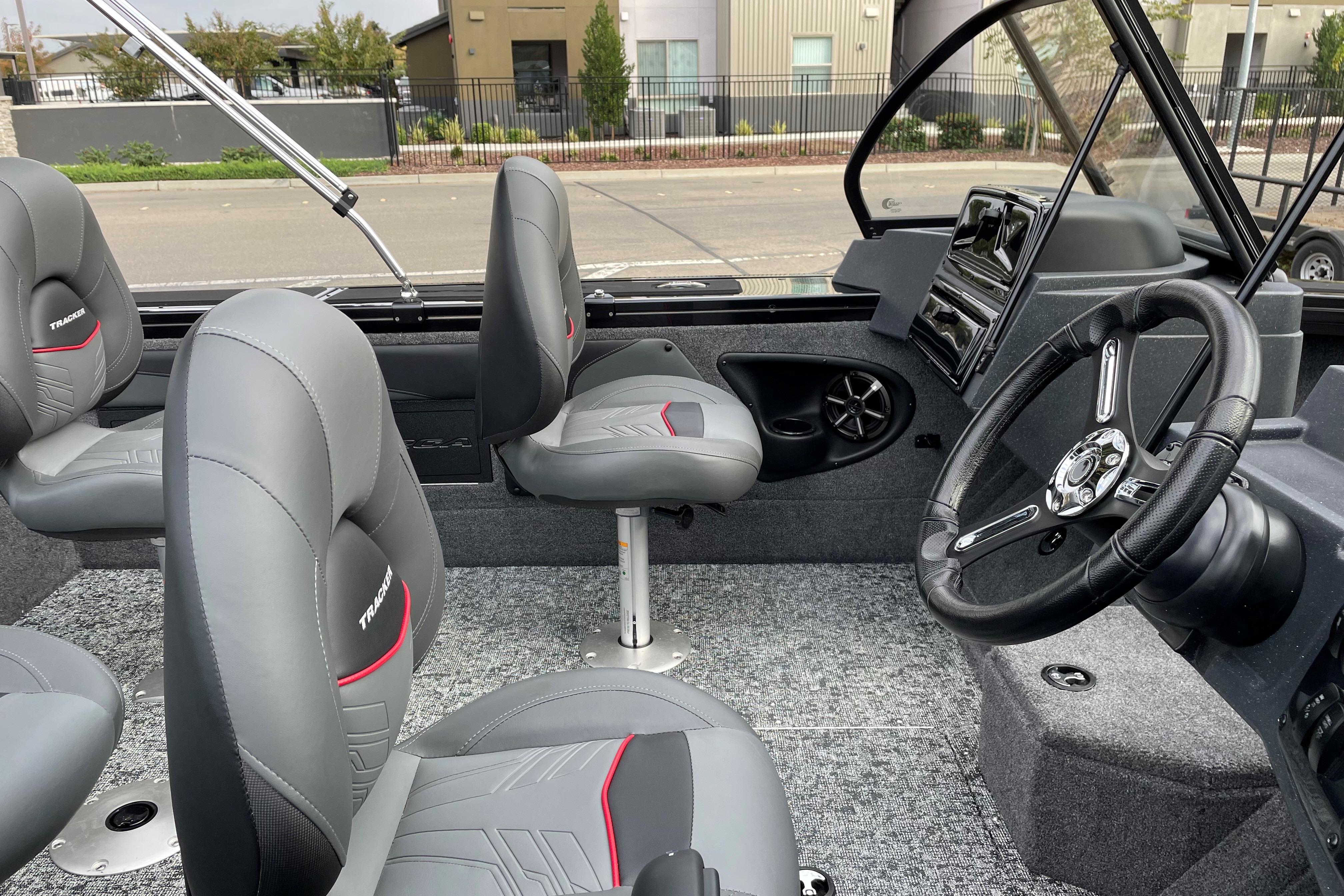 2026 Tracker Targa V-19 WT boat interior with gray seats and steering wheel.