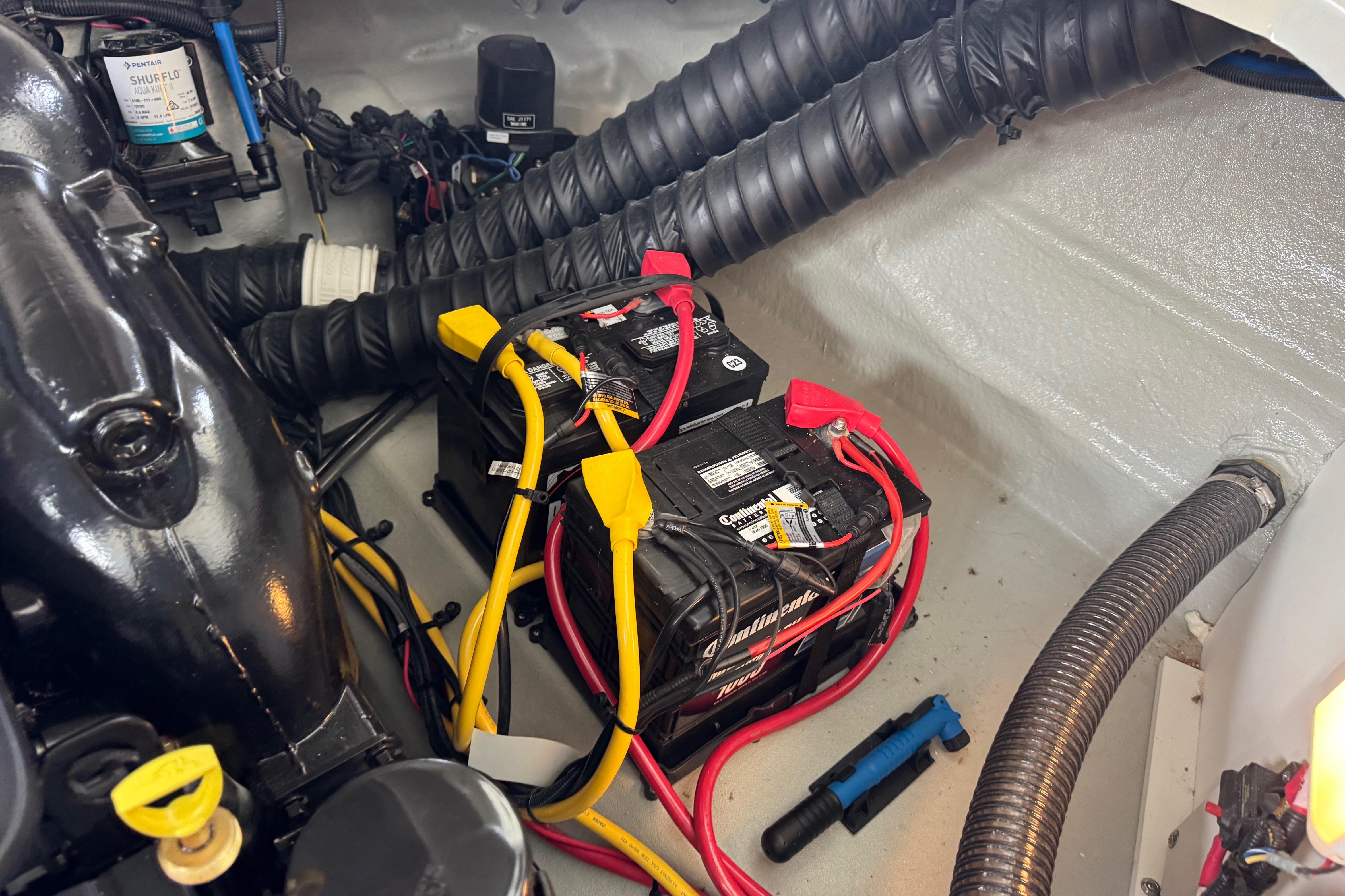 2022 Crownline 265 SS boat engine compartment with batteries and wiring.