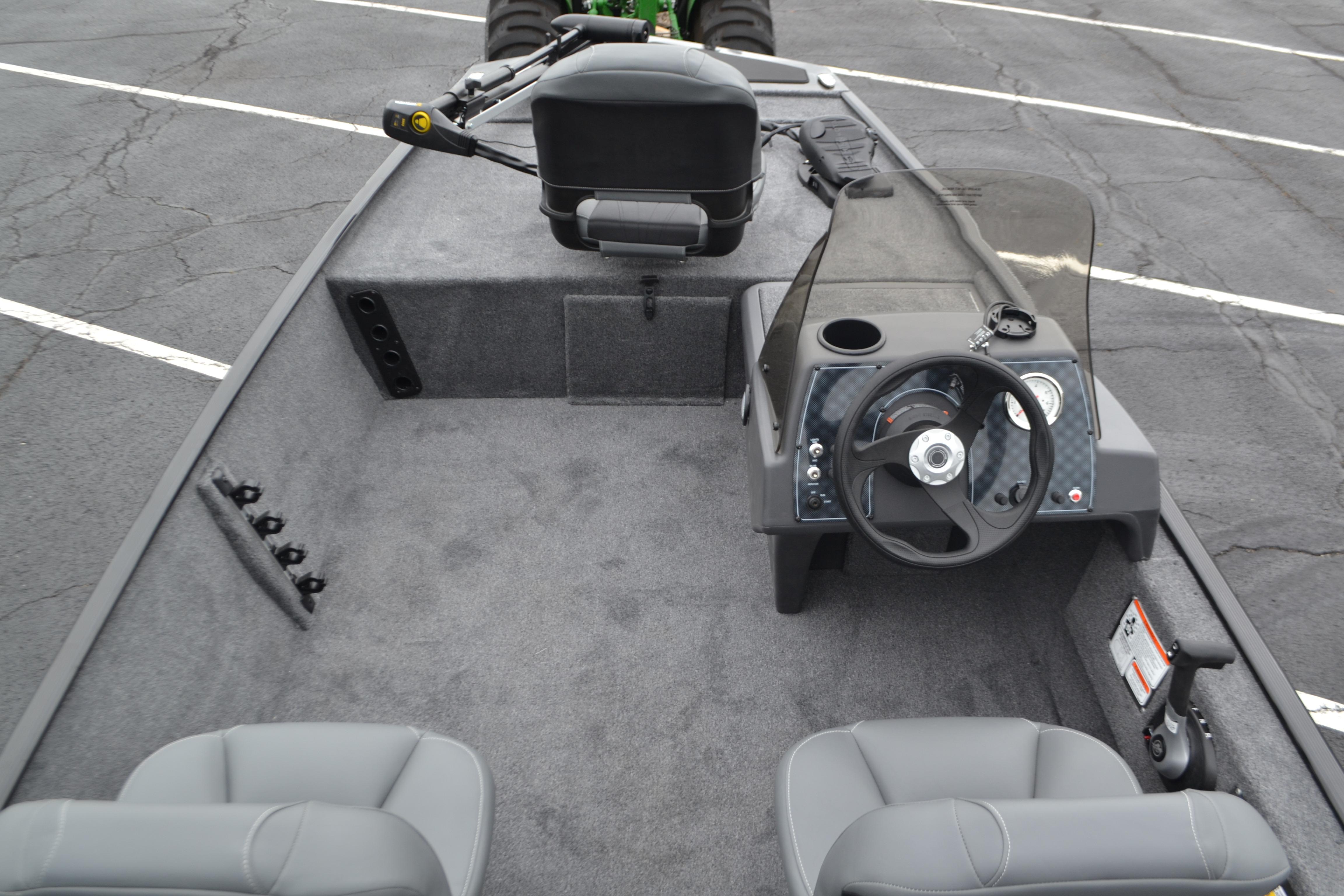 2026 Tracker Bass Tracker Classic XL boat interior with steering wheel and seating.