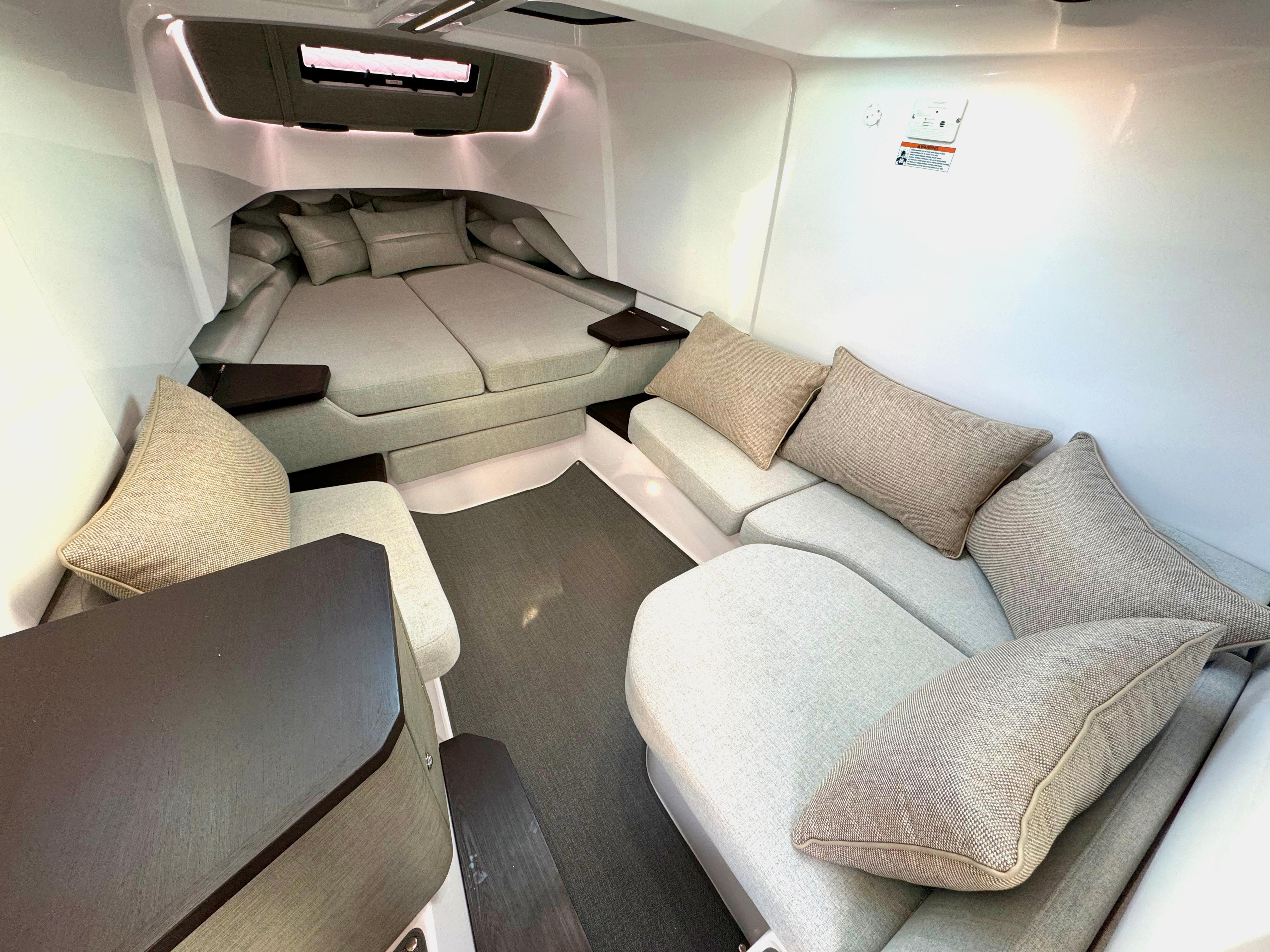 2024 Axopar 37XC CROSS CABIN interior with cozy seating and modern design.