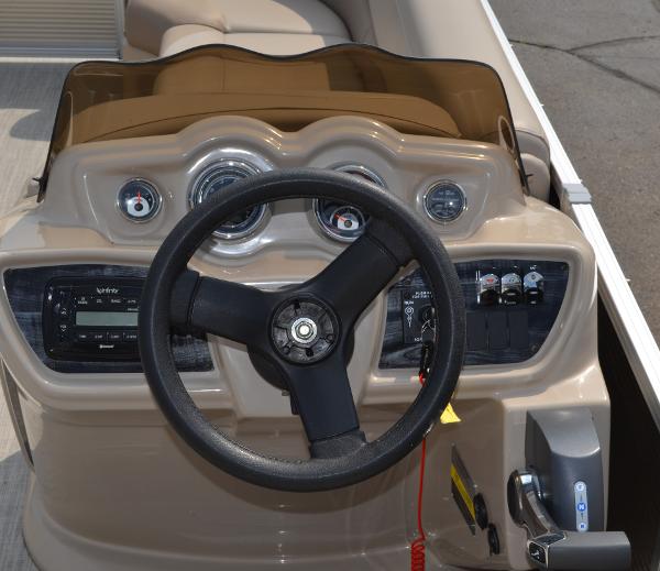 2018 Tahoe LTZ 2285 CR boat dashboard with steering wheel and controls.
