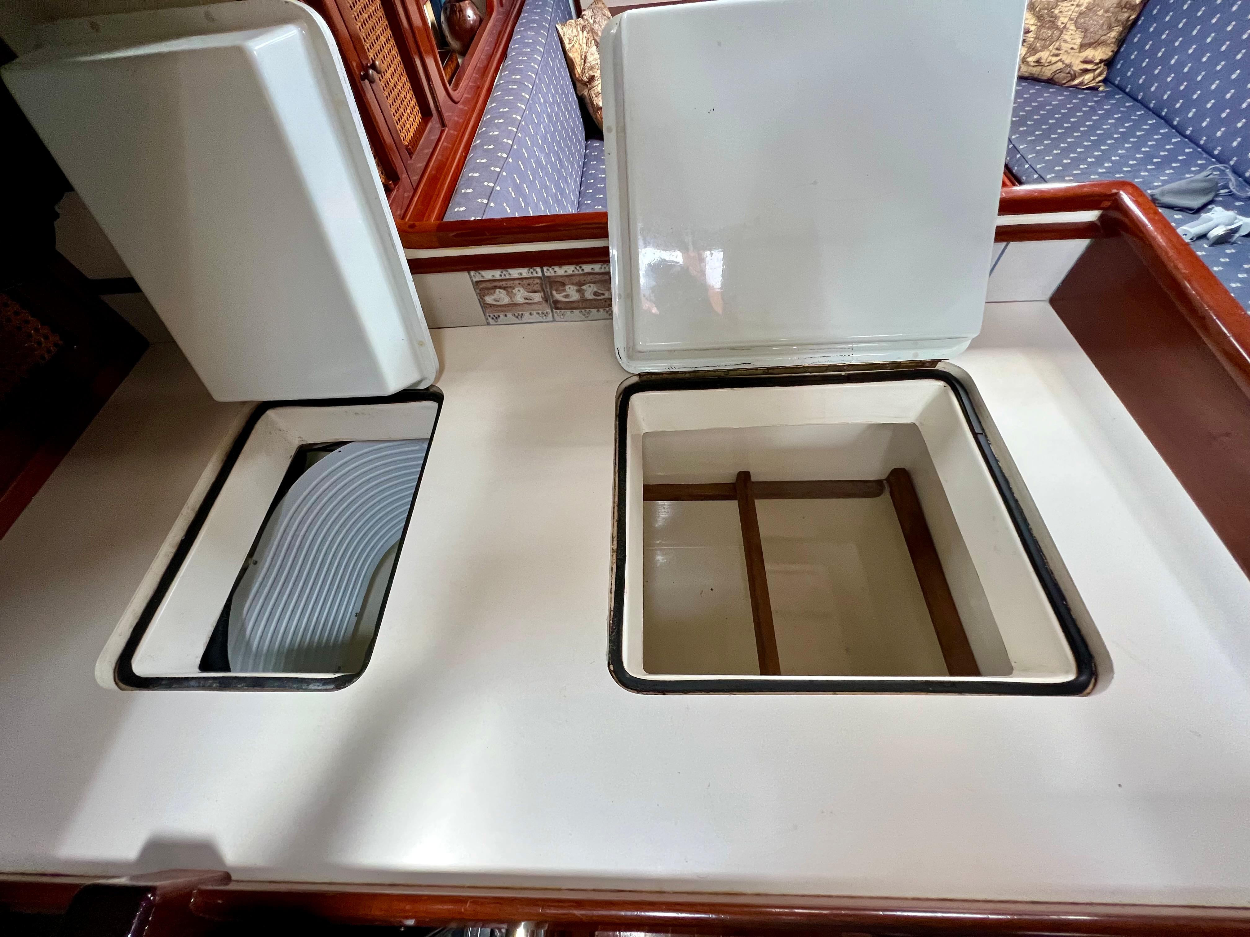 Cherubini 44 yacht galley with open storage compartments, 1986 model.