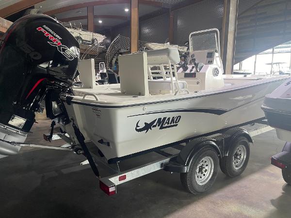 2024 Mako Pro Skiff 19 CC boat on trailer in indoor storage.