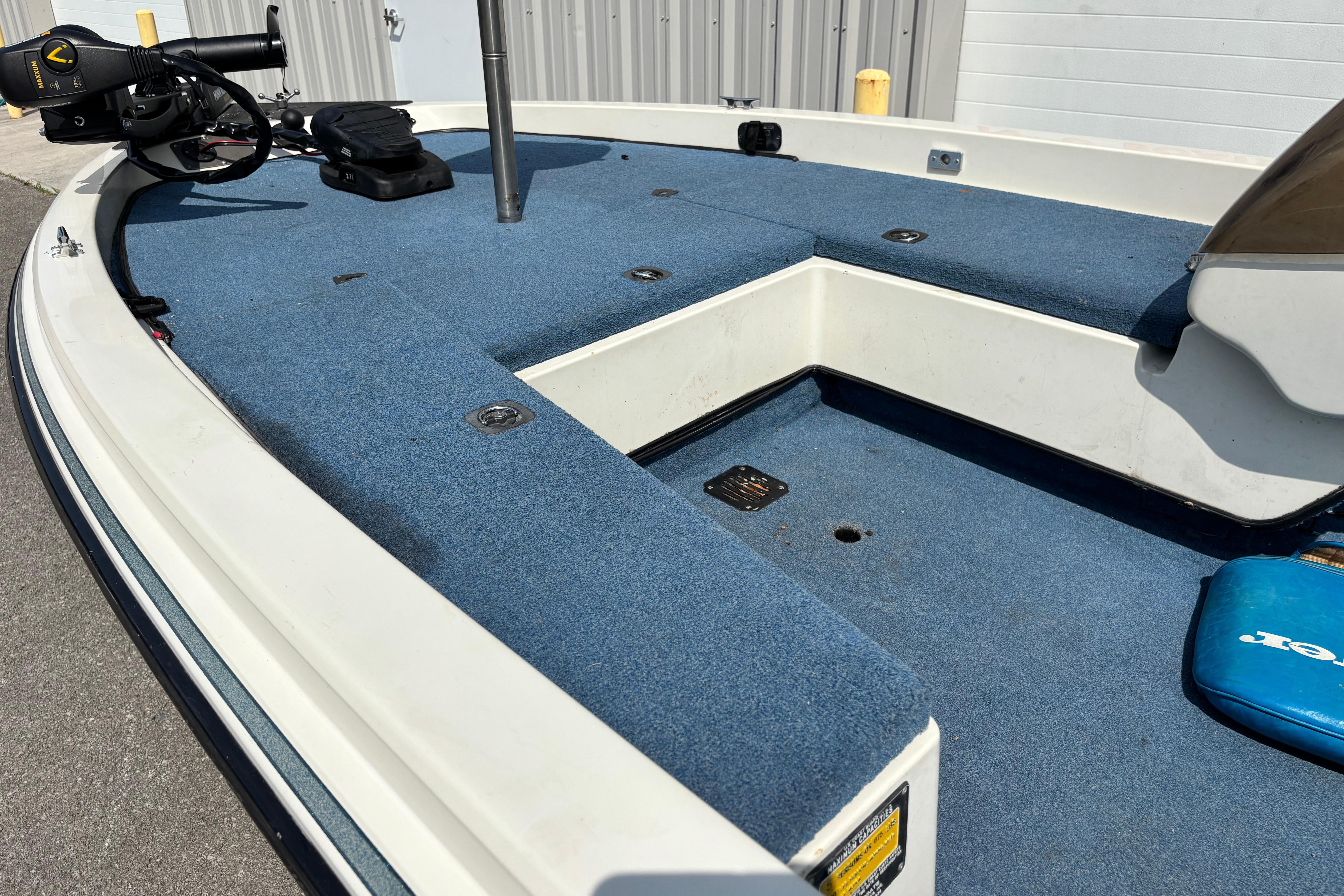 1991 Ranger 461VS boat deck with blue carpet and mounted equipment.