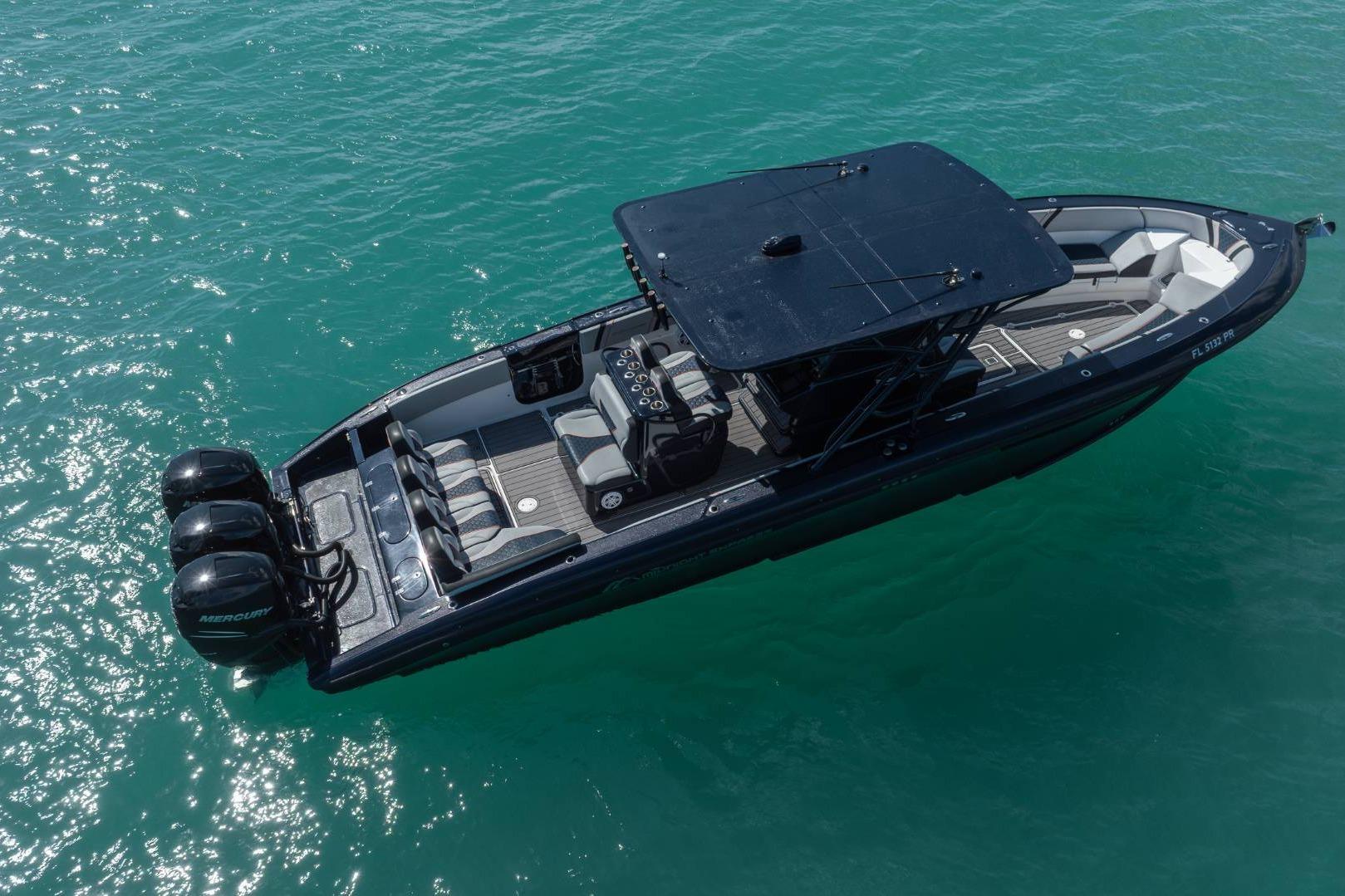2014 Midnight Express 37 Open boat on clear turquoise water, aerial view.