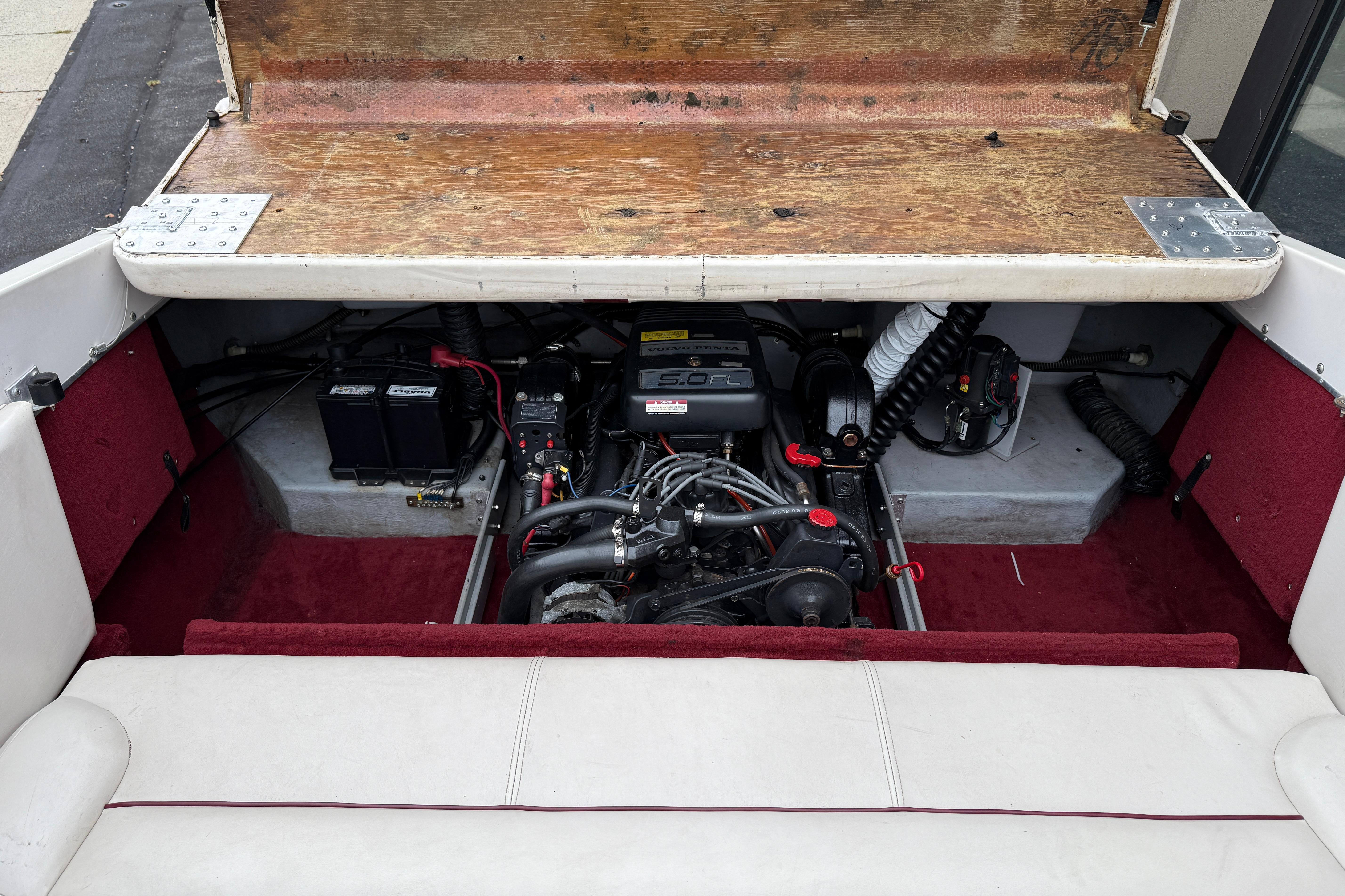 Engine compartment of a 1999 Chaparral 1930 SS boat, showcasing a 5.0 FL engine.
