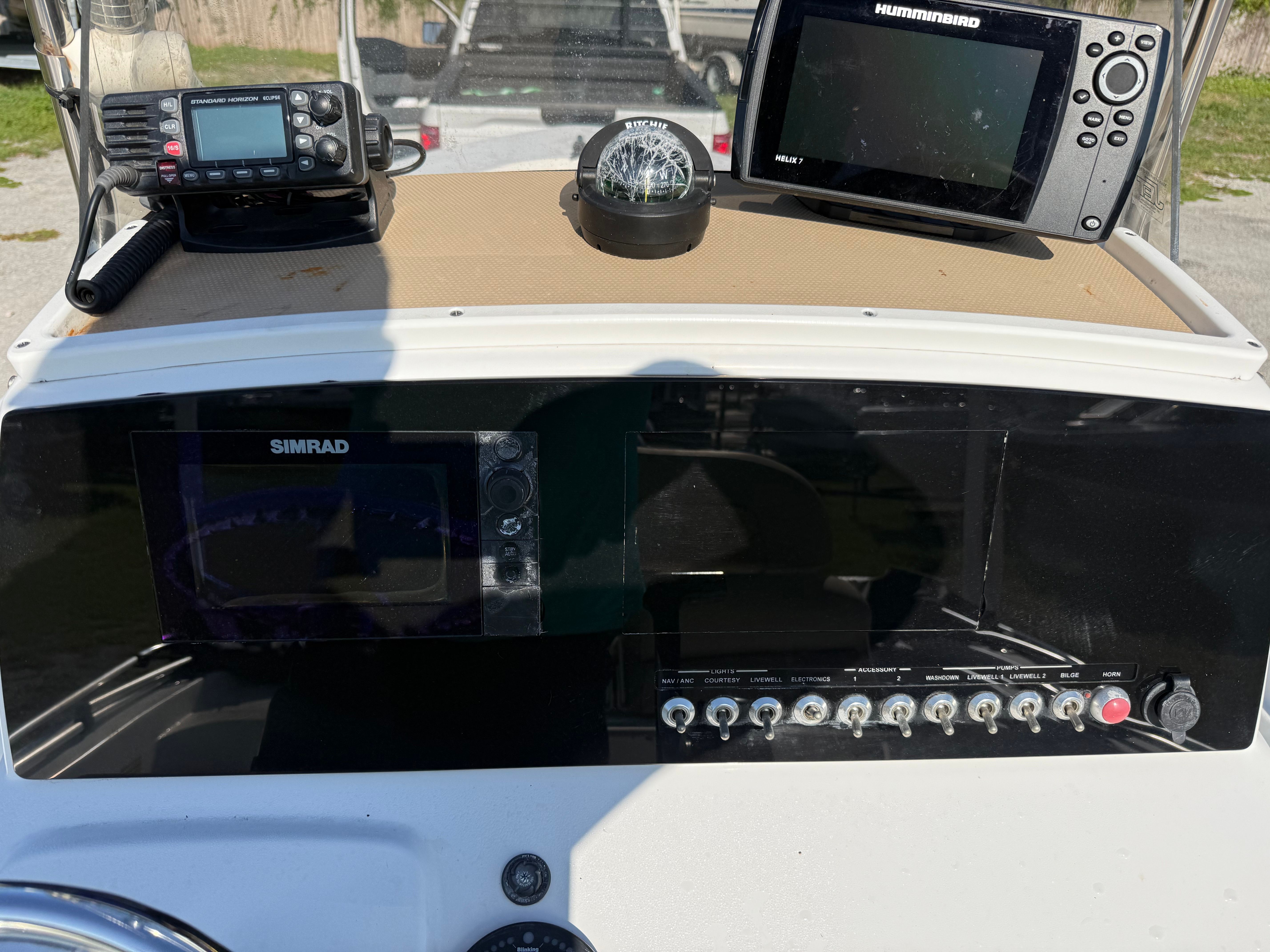 The dashboard of a 2016 Sportsman Masters 227 Bay Boat with navigation equipment.