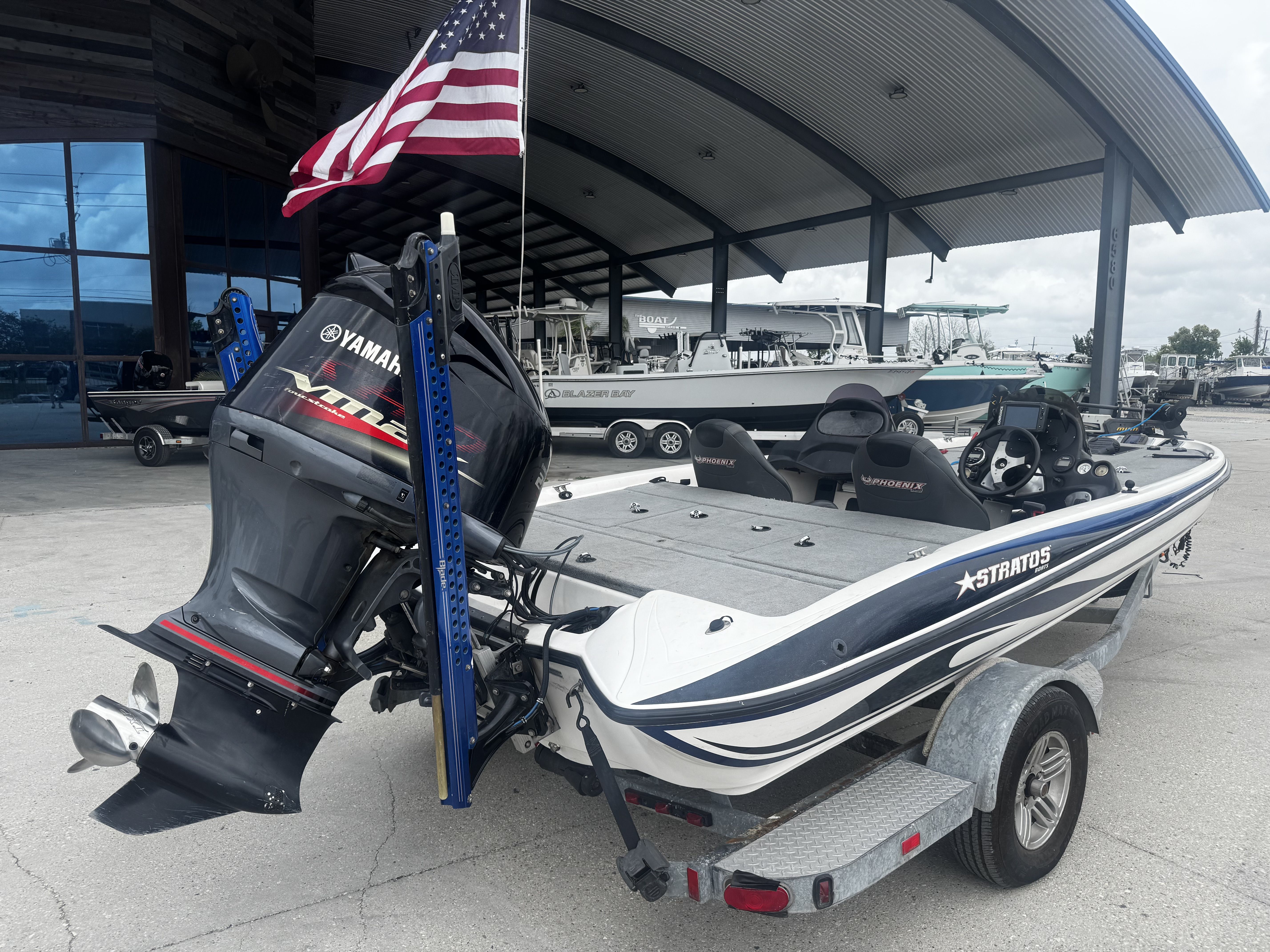2006 Stratos 285 Pro XL boat with Yamaha engine, American flag.