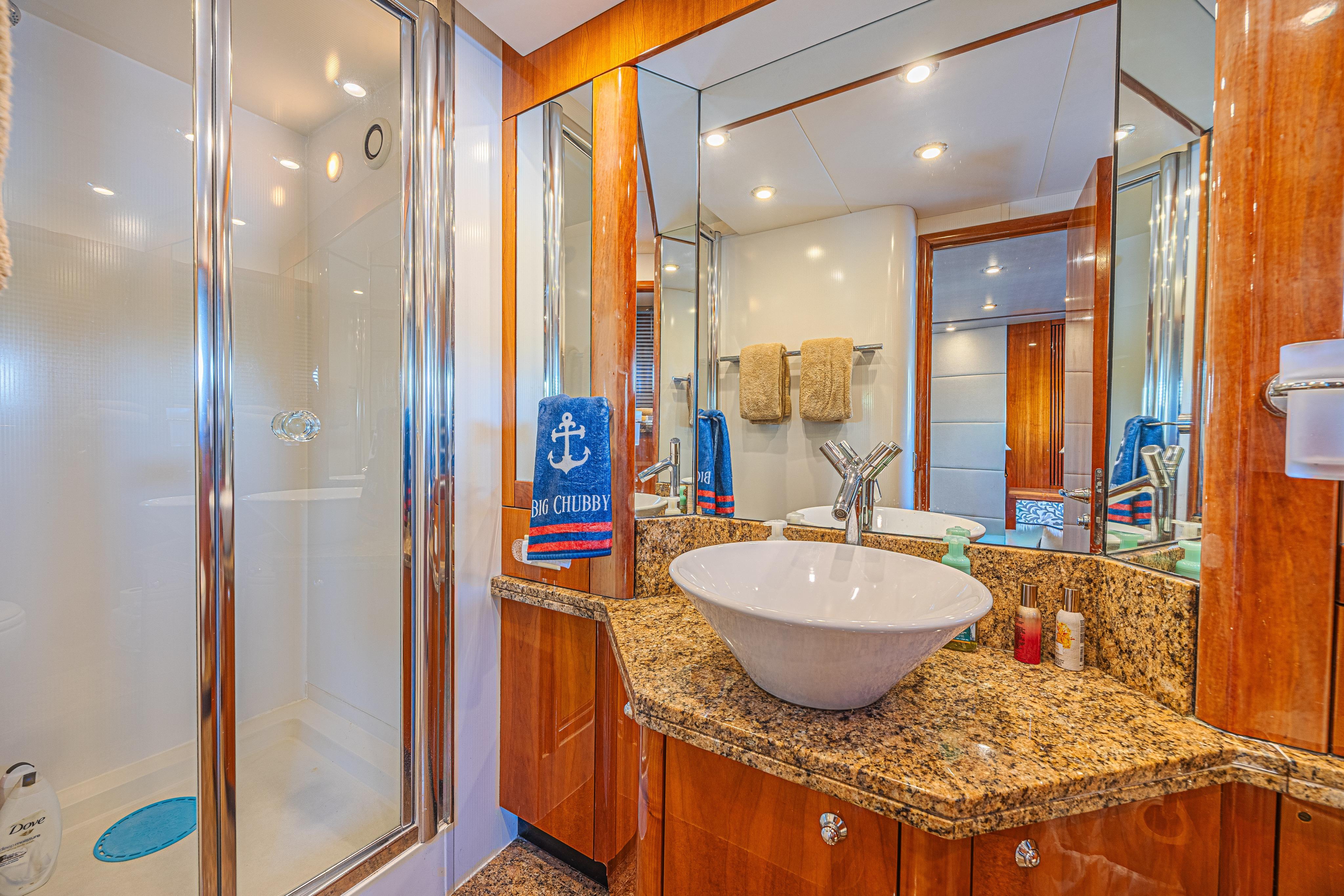 Luxurious bathroom in 2006 Sunseeker 75 Yacht with granite countertop and modern fixtures.