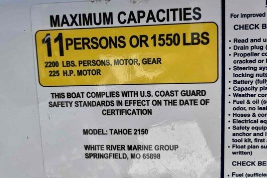 Maximum capacity label for 2023 Tahoe 2150 boat, 11 persons or 1550 lbs.