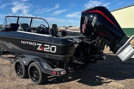 2026 Nitro ZV20 Pro boat with powerful outboard motor, parked on a trailer.
