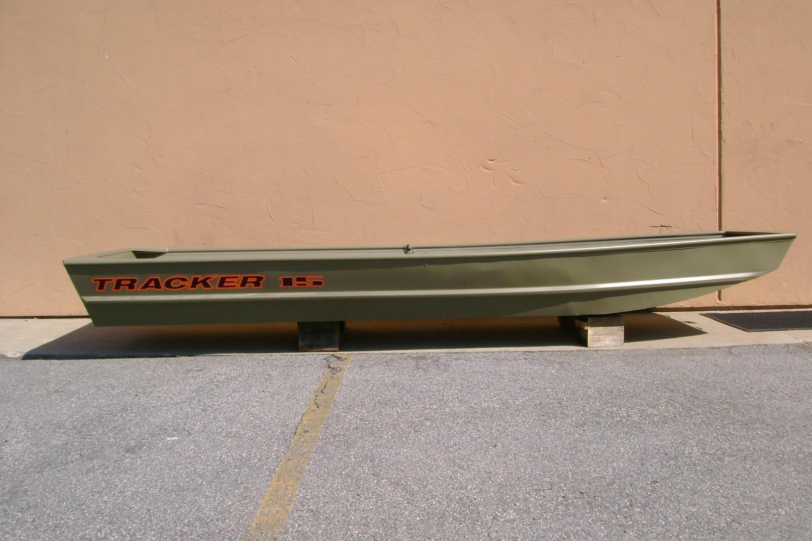 2026 Tracker Grizzly 15 Jon boat displayed outdoors on concrete blocks.