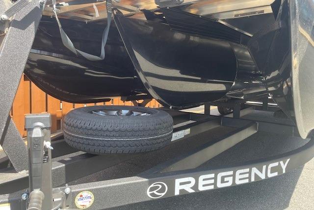 2026 Regency 250 DL boat trailer with spare tire, showcasing sleek design and branding.