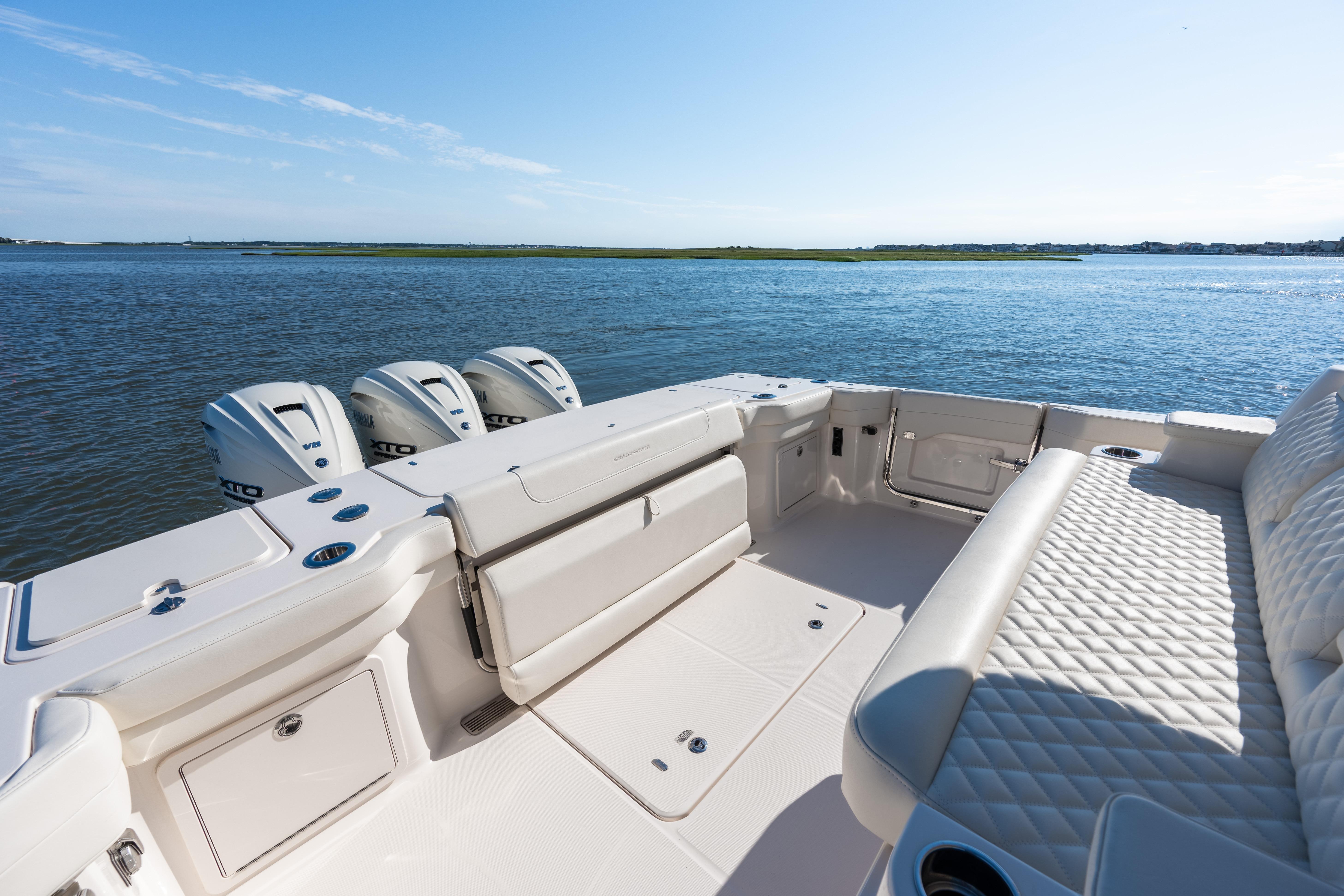 2025 Grady-White Canyon 386 boat interior with luxurious seating and triple outboard engines.