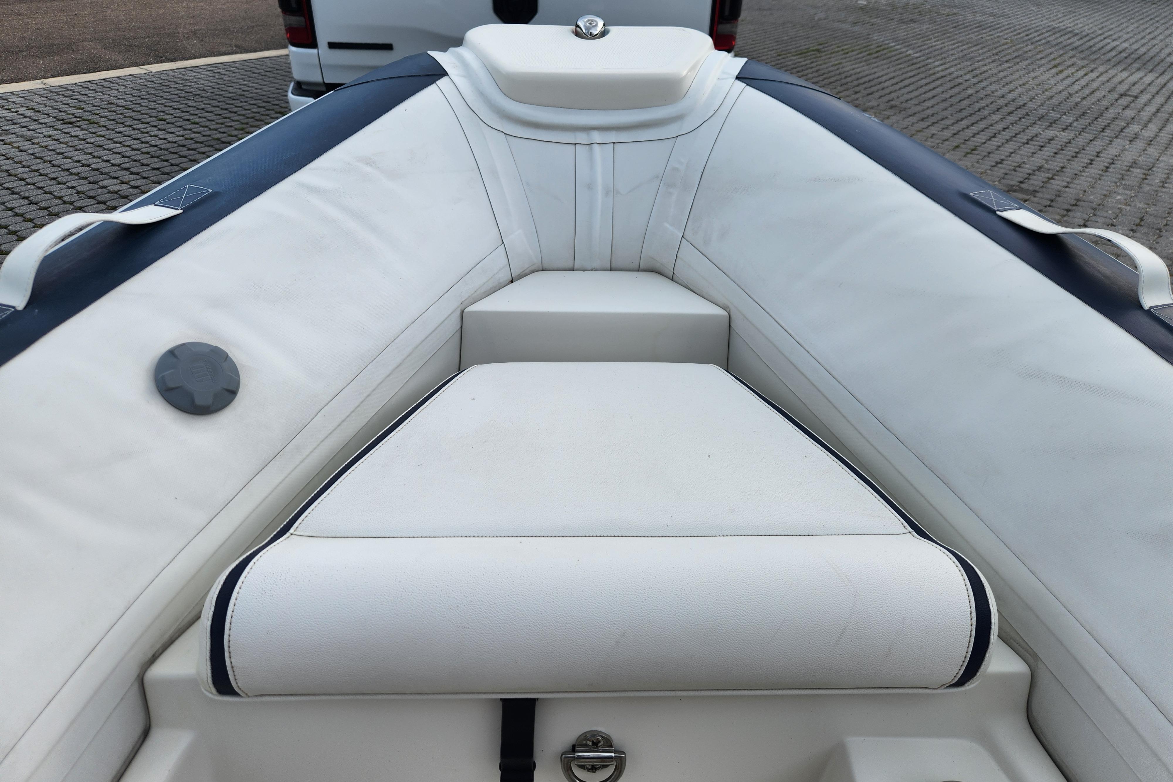 2019 Novurania DL 400 boat interior with white seating and sleek design.