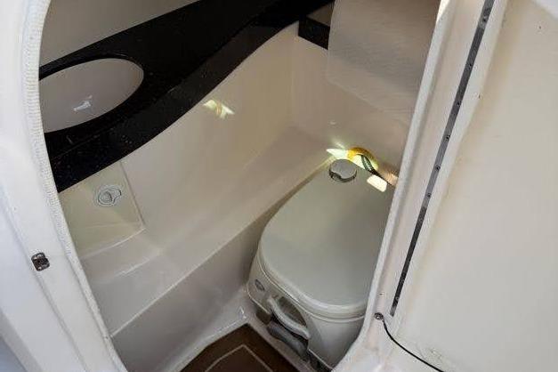 2014 Regal 2500 Bowrider boat interior with compact marine toilet.