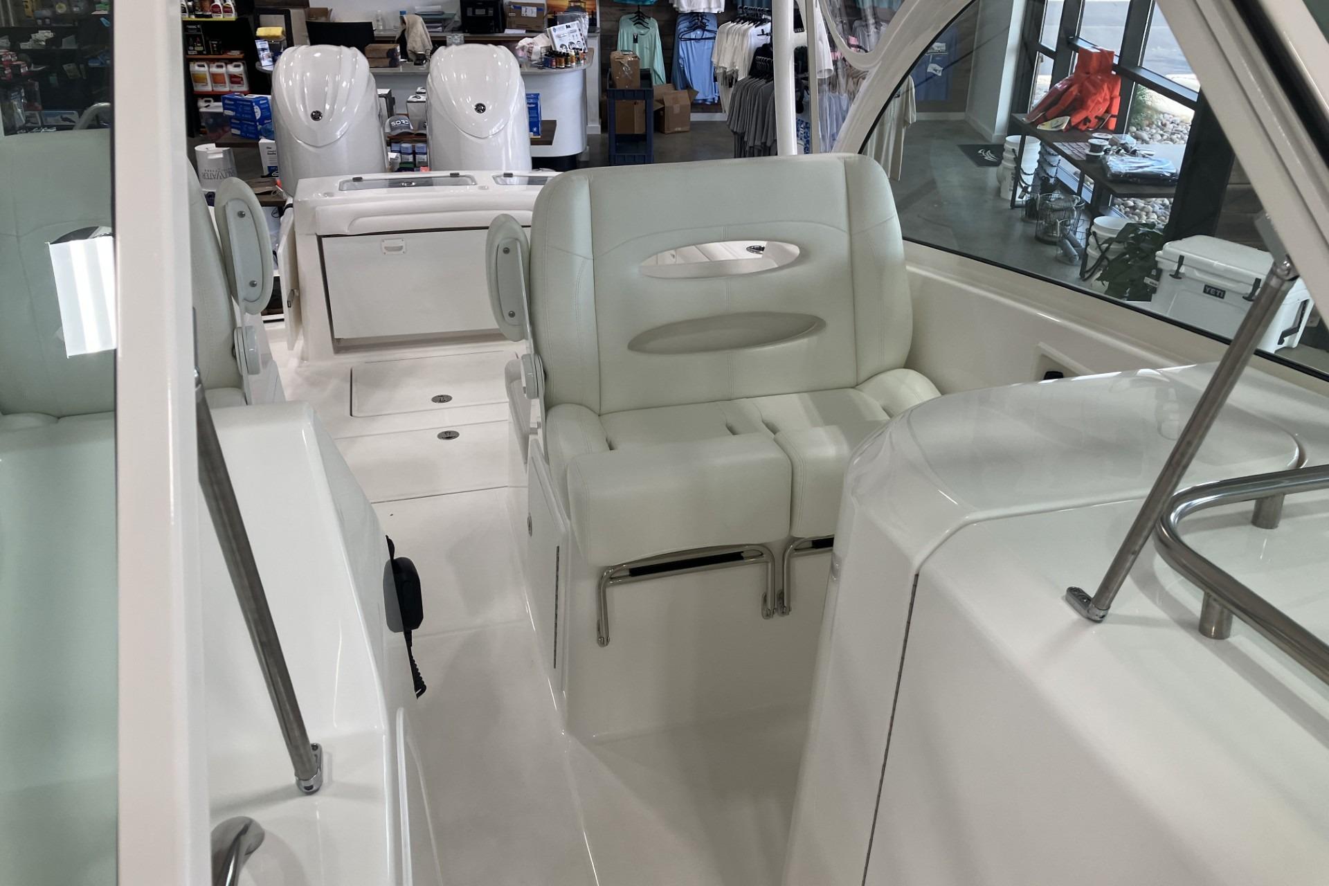 2026 Albemarle 27 Dual Console boat interior with white seating and modern design.