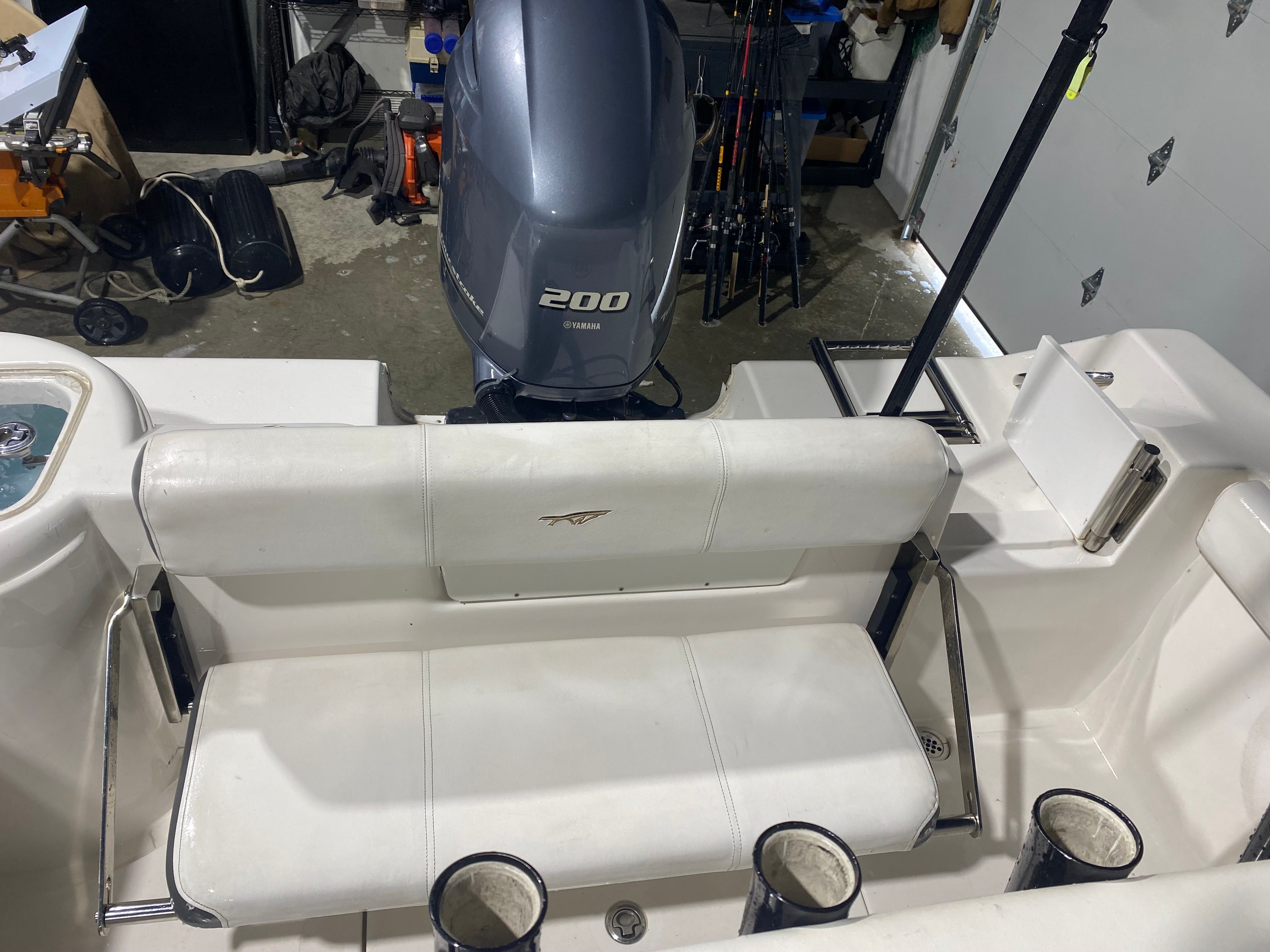 Rear seating and engine of a 2015 Tidewater 220 CC Adventure boat.
