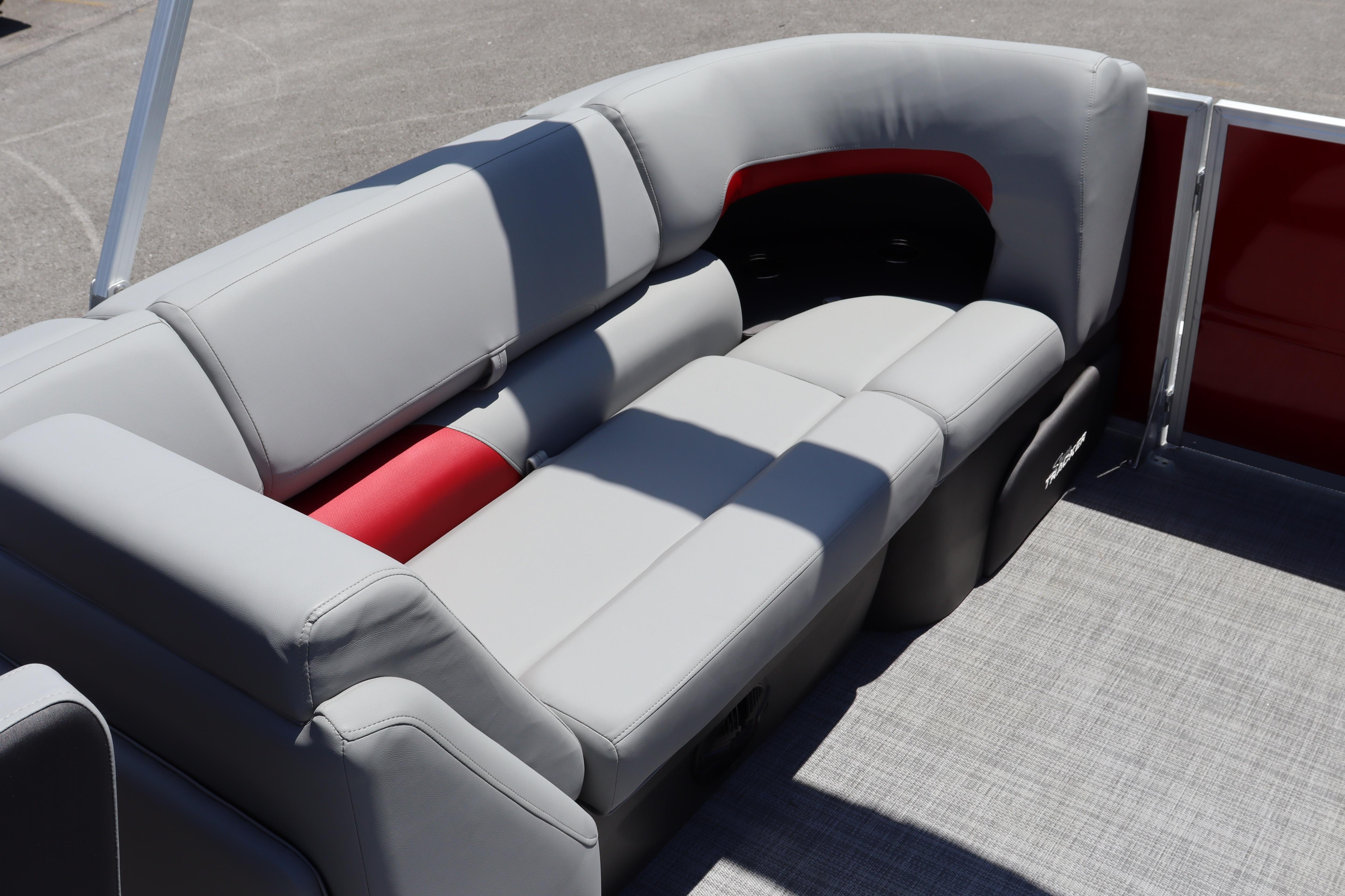 2026 Sun Tracker Party Barge 22 XP3 with gray and red seating on deck.