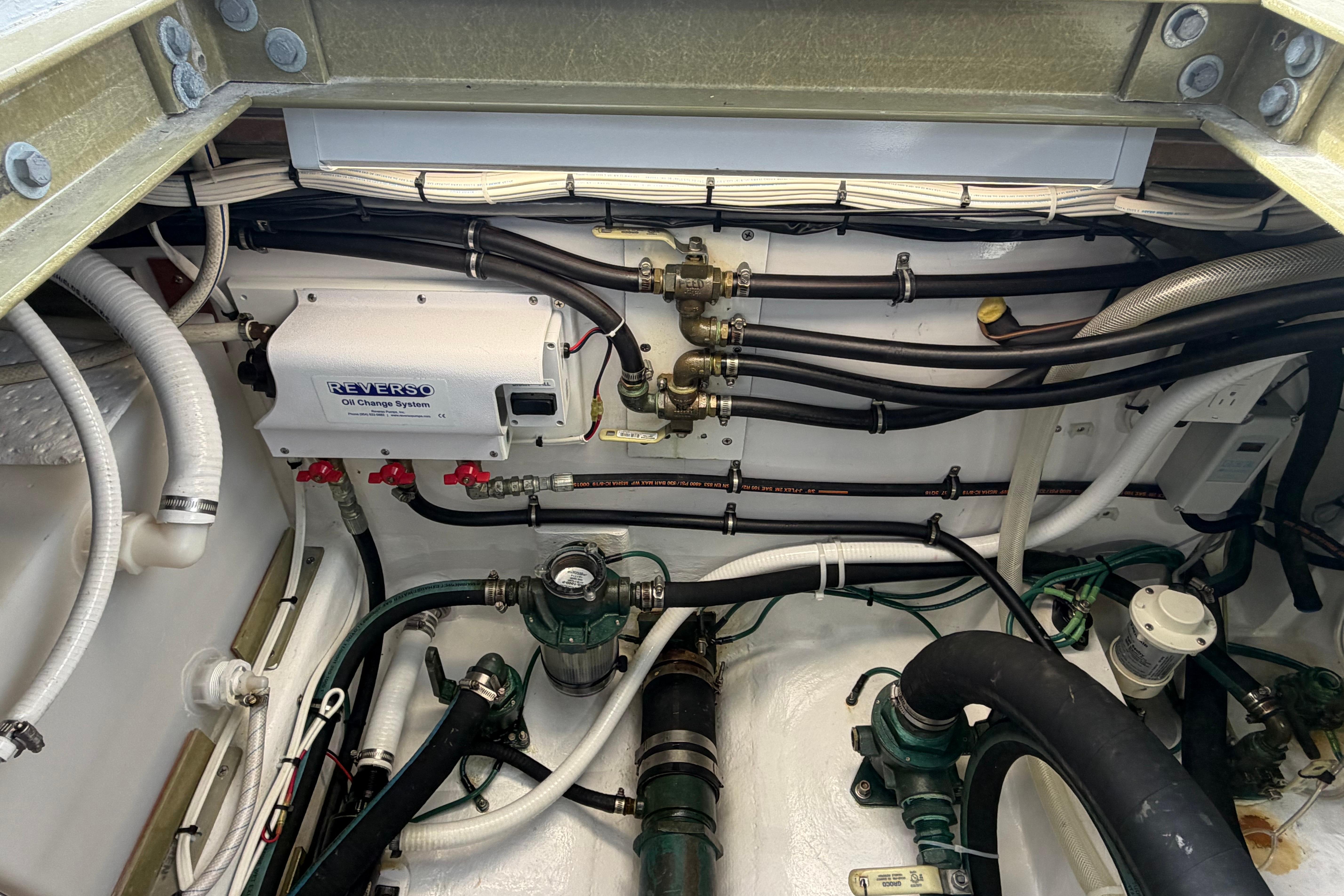 Engine room of 2018 H&H Marine Osmond Beal boat with Reverso oil change system.