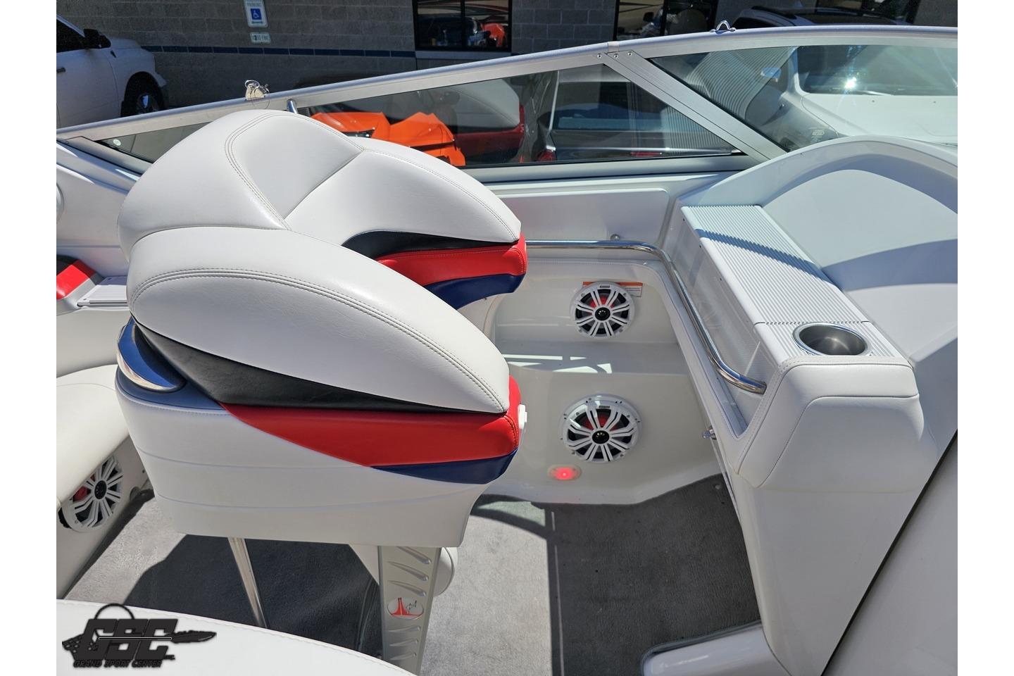 Interior of a 2005 Formula 271 FASTech boat with stylish seating and speaker system.