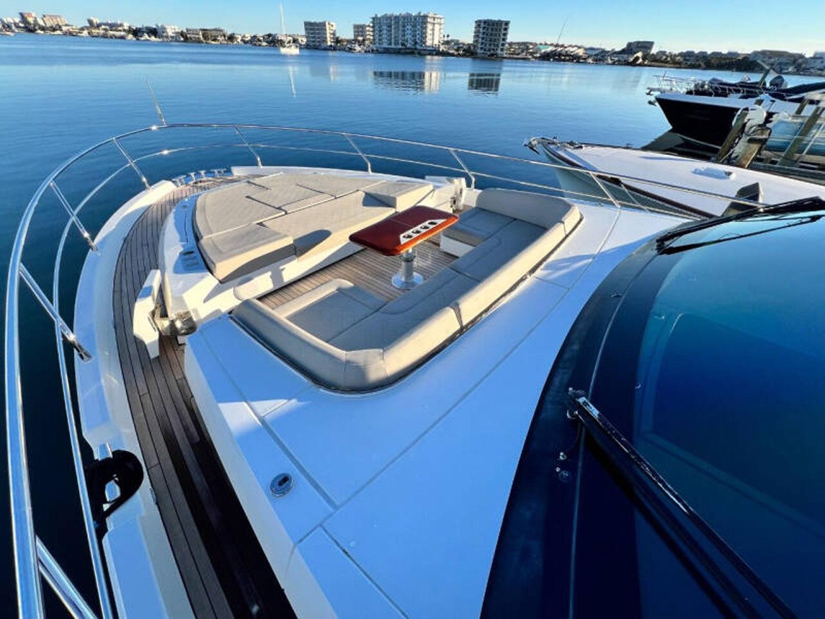 Luxurious 2020 Fairline Squadron 68 yacht with spacious deck and seating area.