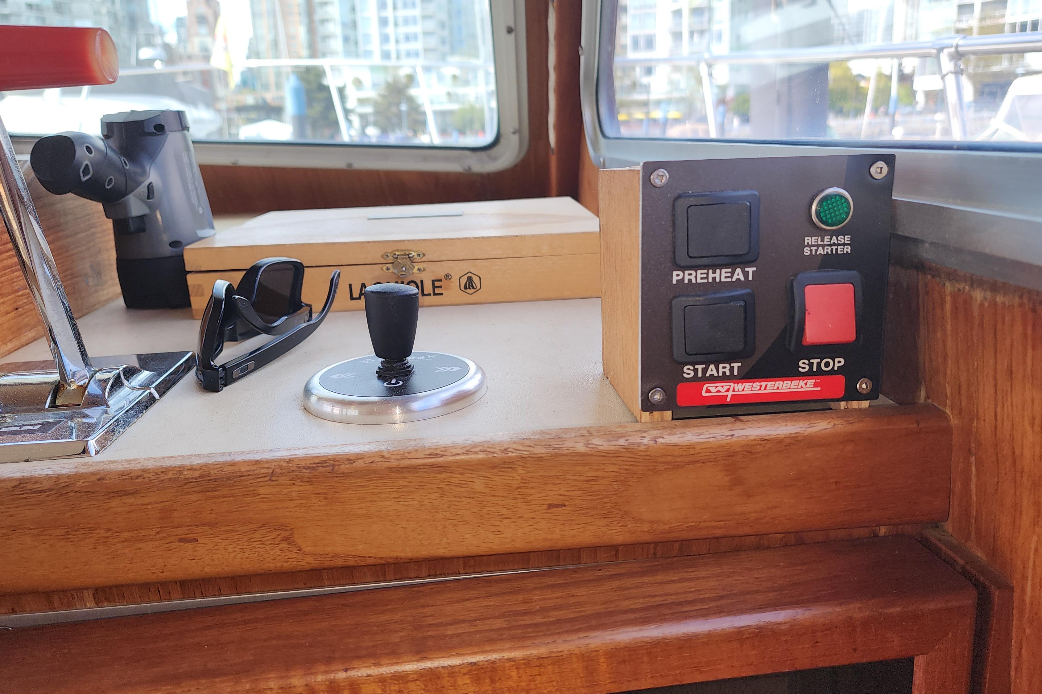 Control panel and accessories on a 1981 Tollycraft 43 boat dashboard.