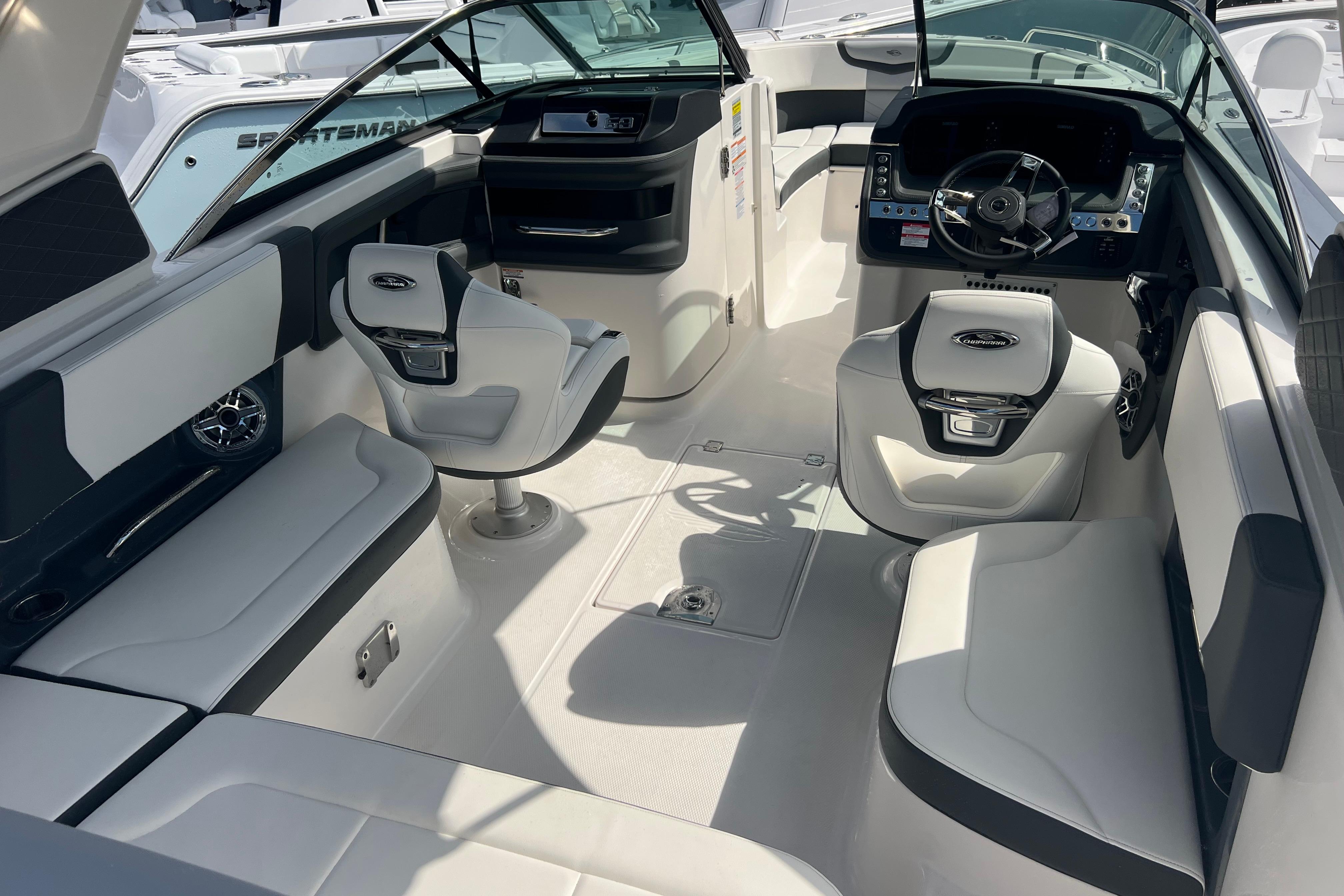 2025 Chaparral 270 OSX boat interior with modern seating and steering console.