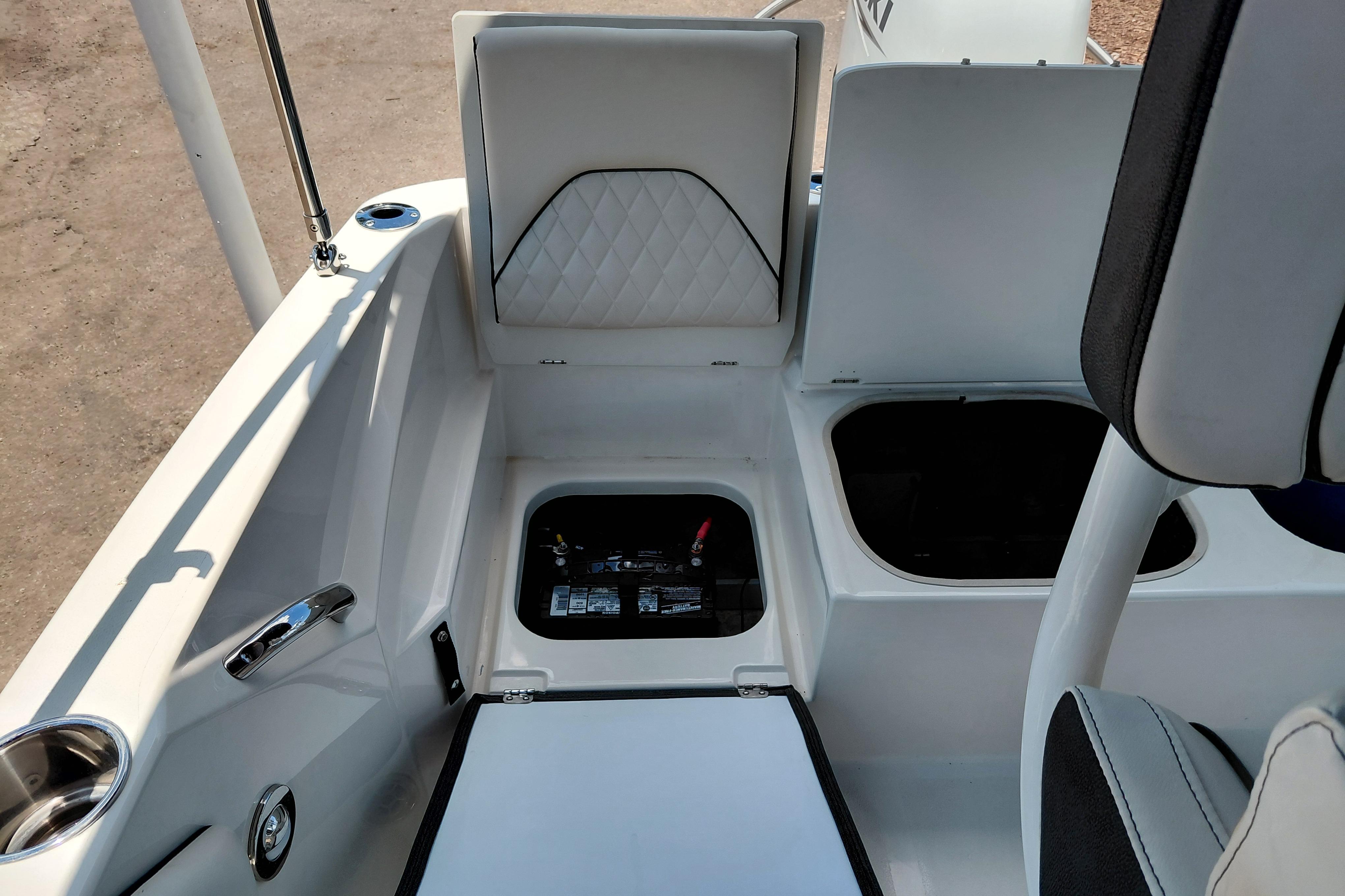 2023 Stingray 206 CC boat interior with open storage compartments and seating.